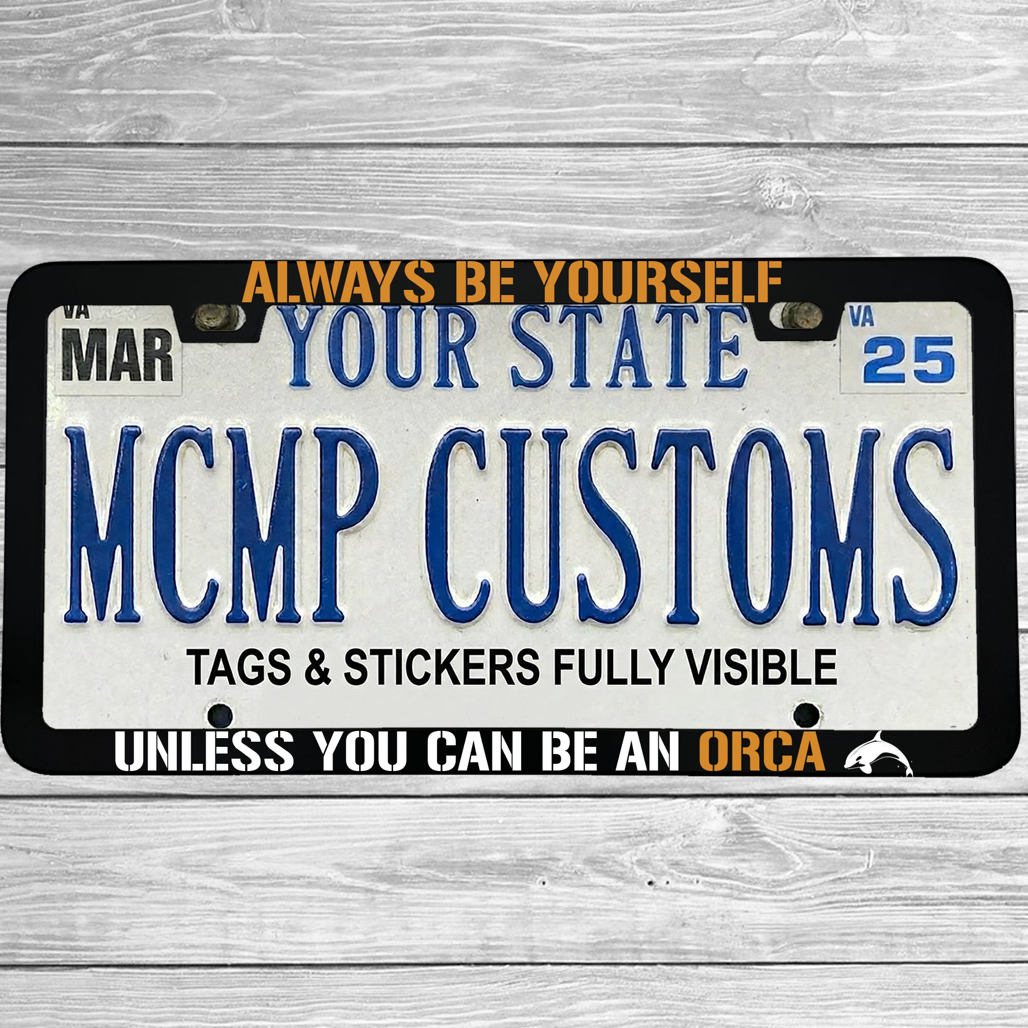 "Always Be Yourself Unless You Can Be An Orca" license plate frame shown on vehicle β lifestyle photo