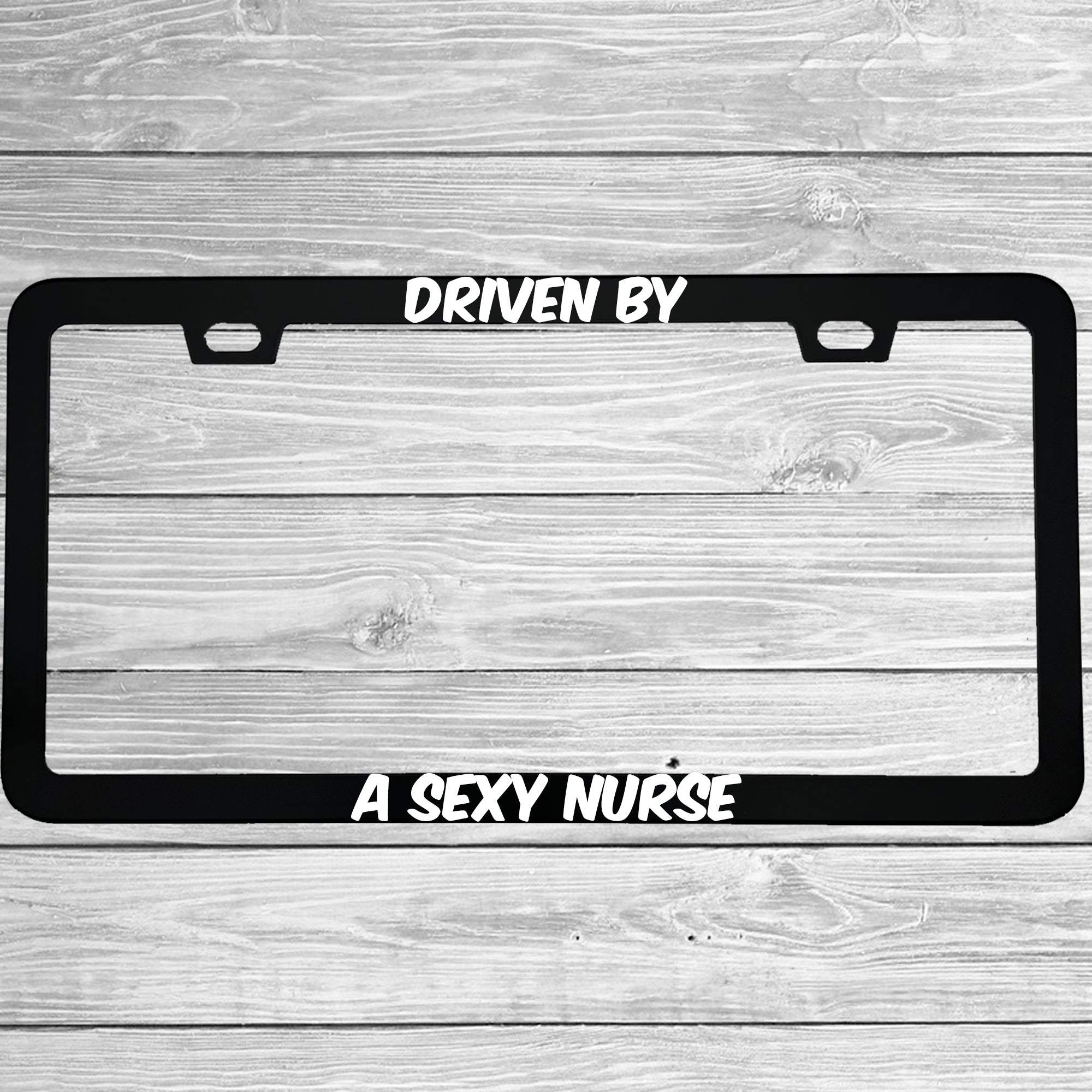 Close-up of "Driven By A Sexy Nurse" license plate frame showing fade-proof print quality