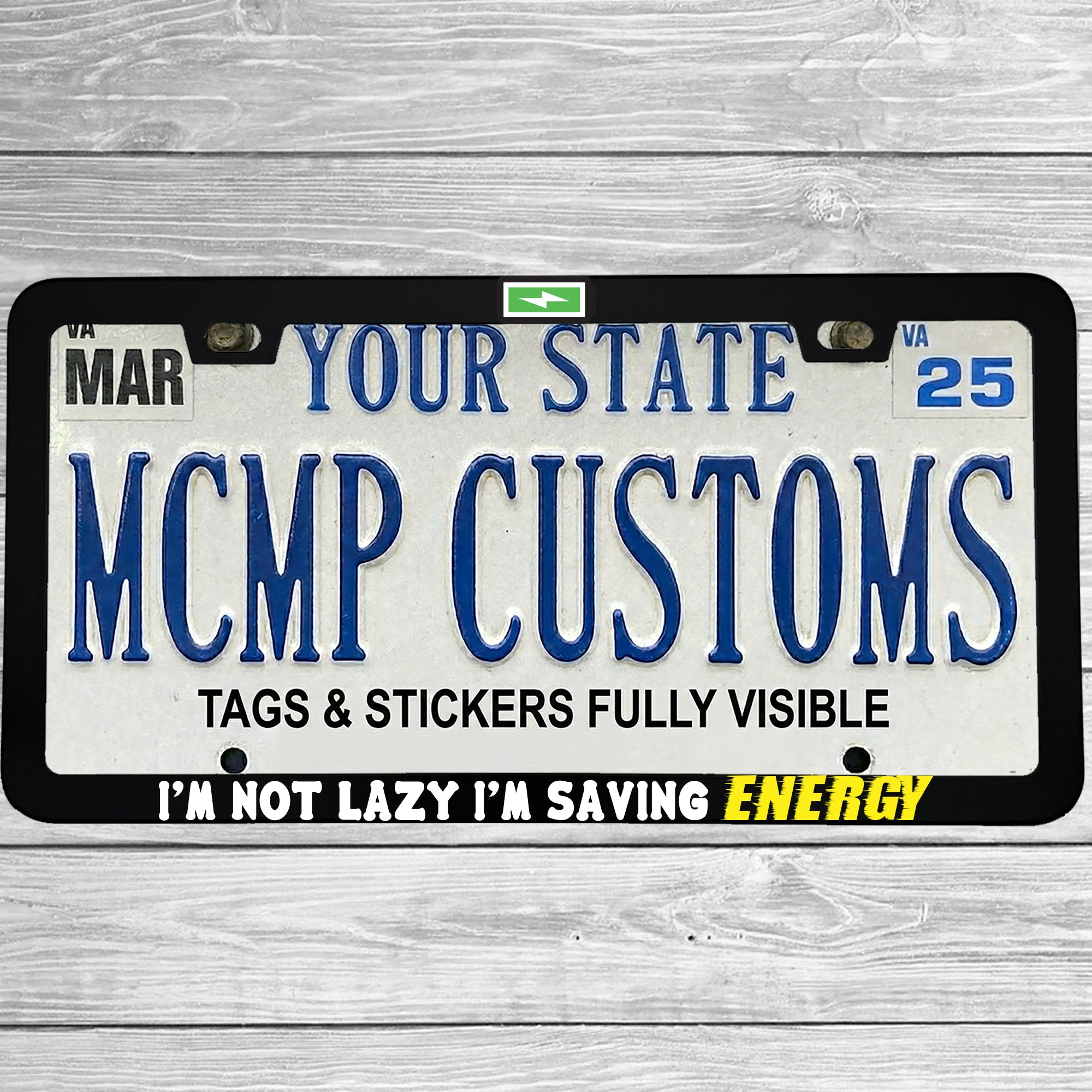 "I'm Not Lazy, I'm Saving Energy" license plate frame shown on vehicle β lifestyle photo