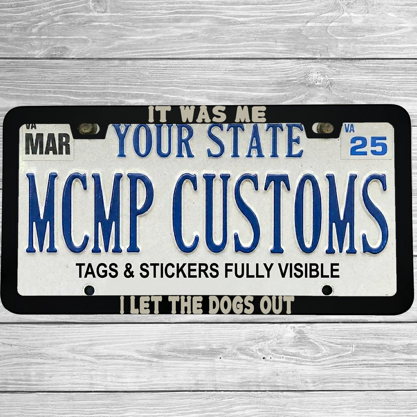 "It Was Me, I Let The Dogs Out" license plate frame shown on vehicle β lifestyle photo