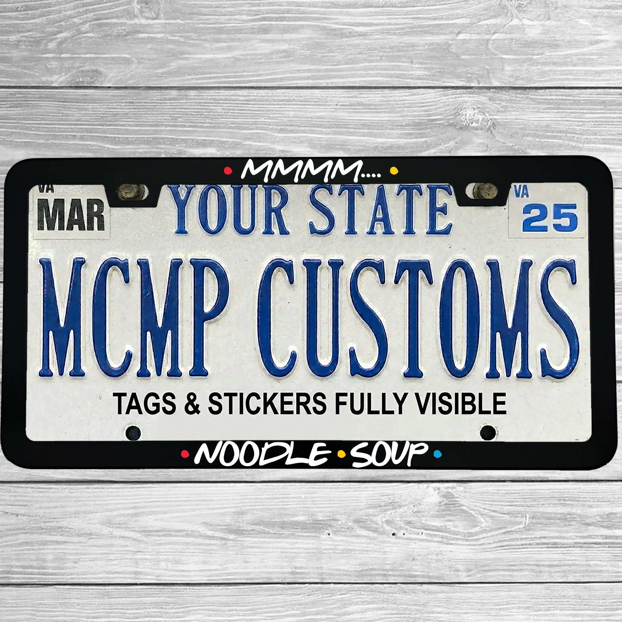 "Mmmm.... Noodle Soup" license plate frame shown on vehicle β lifestyle photo