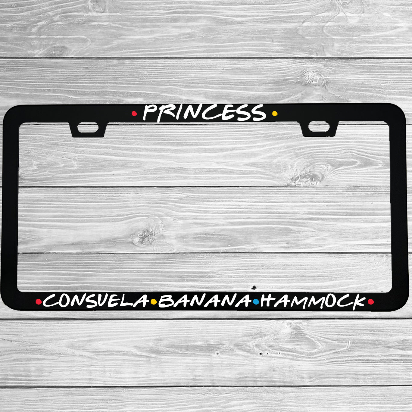 Close-up of "Princess Consuela Banana Hammock" license plate frame showing fade-proof print quality