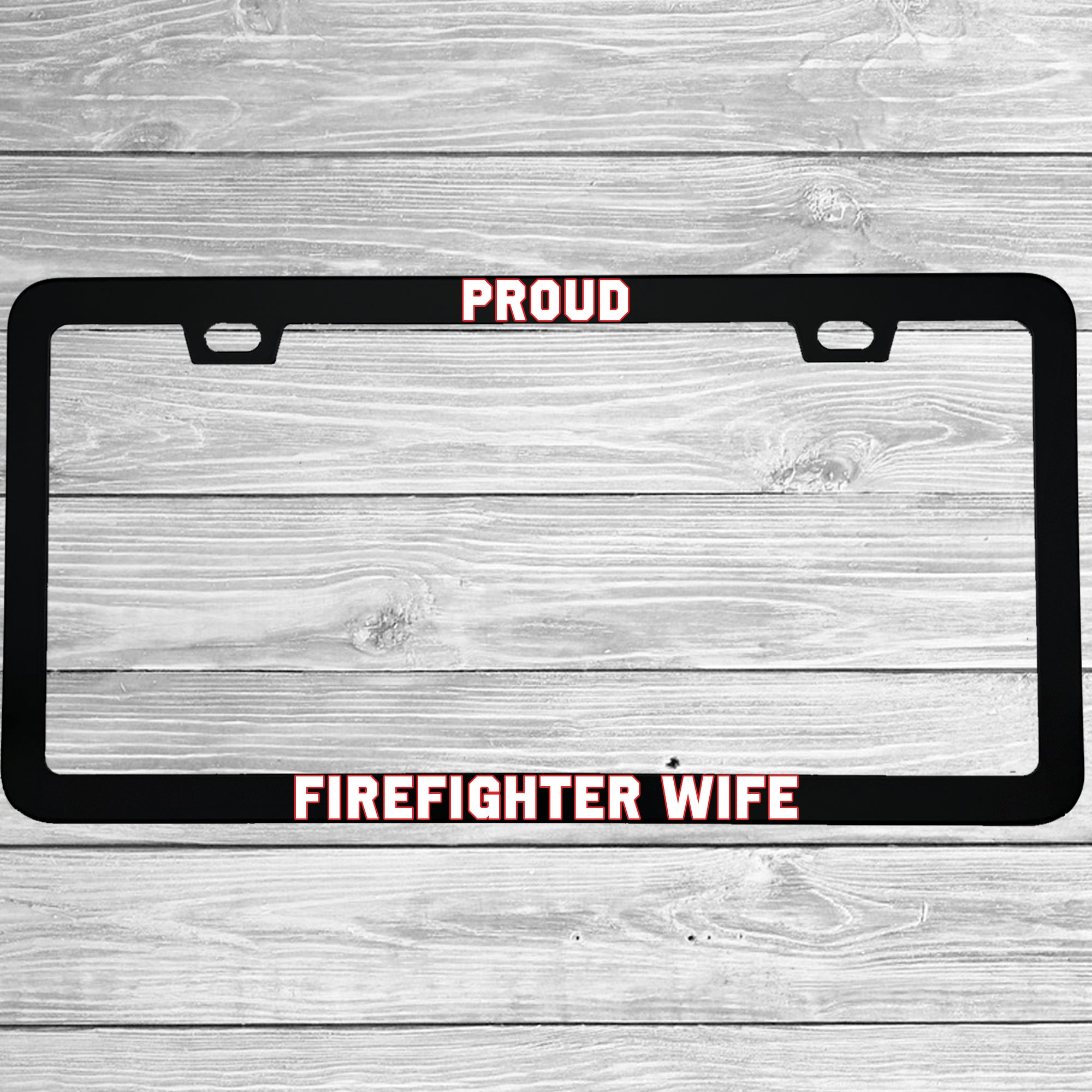 Close-up of "Proud Firefighter Wife" license plate frame showing fade-proof print quality