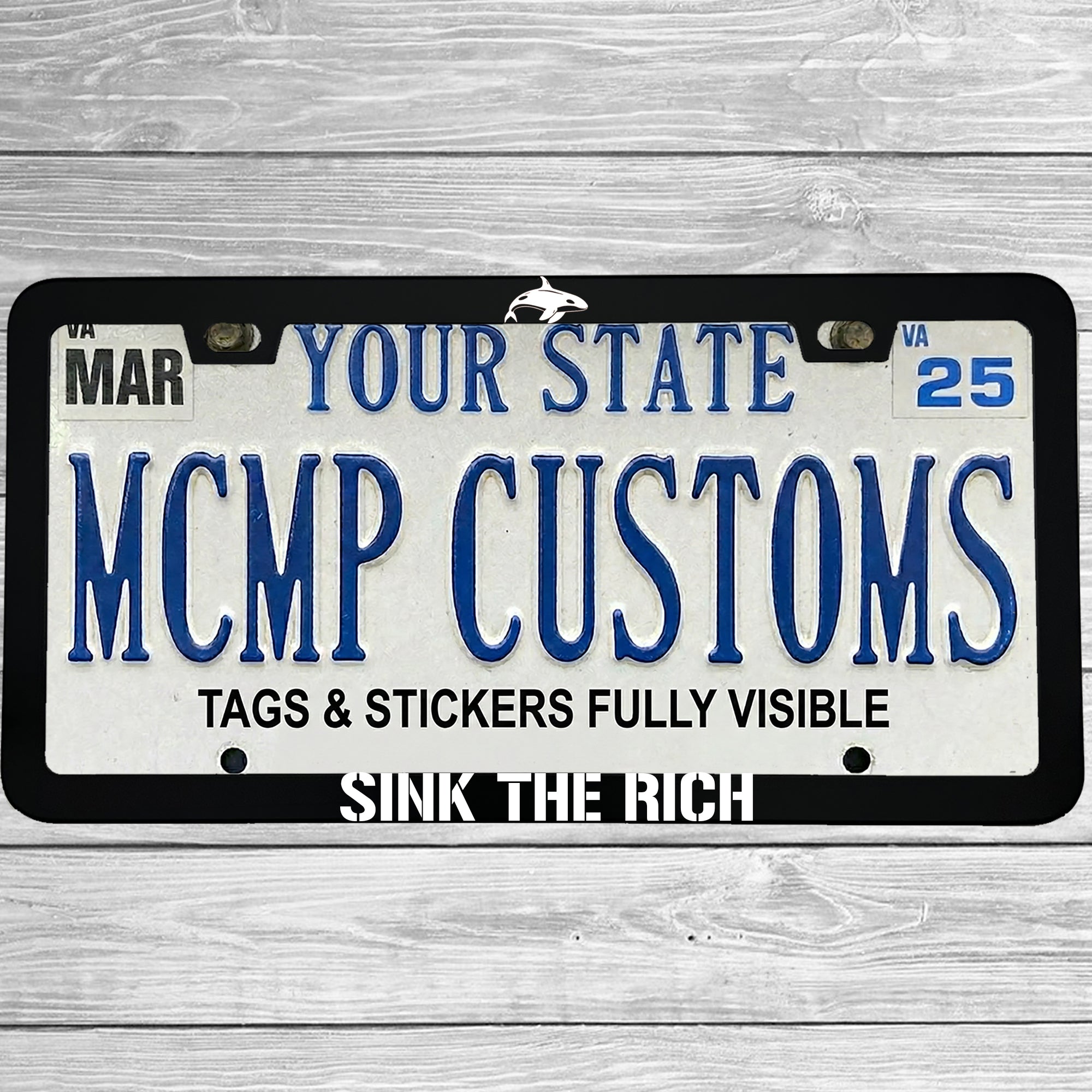 "Sink The Rich" license plate frame shown on vehicle β lifestyle photo