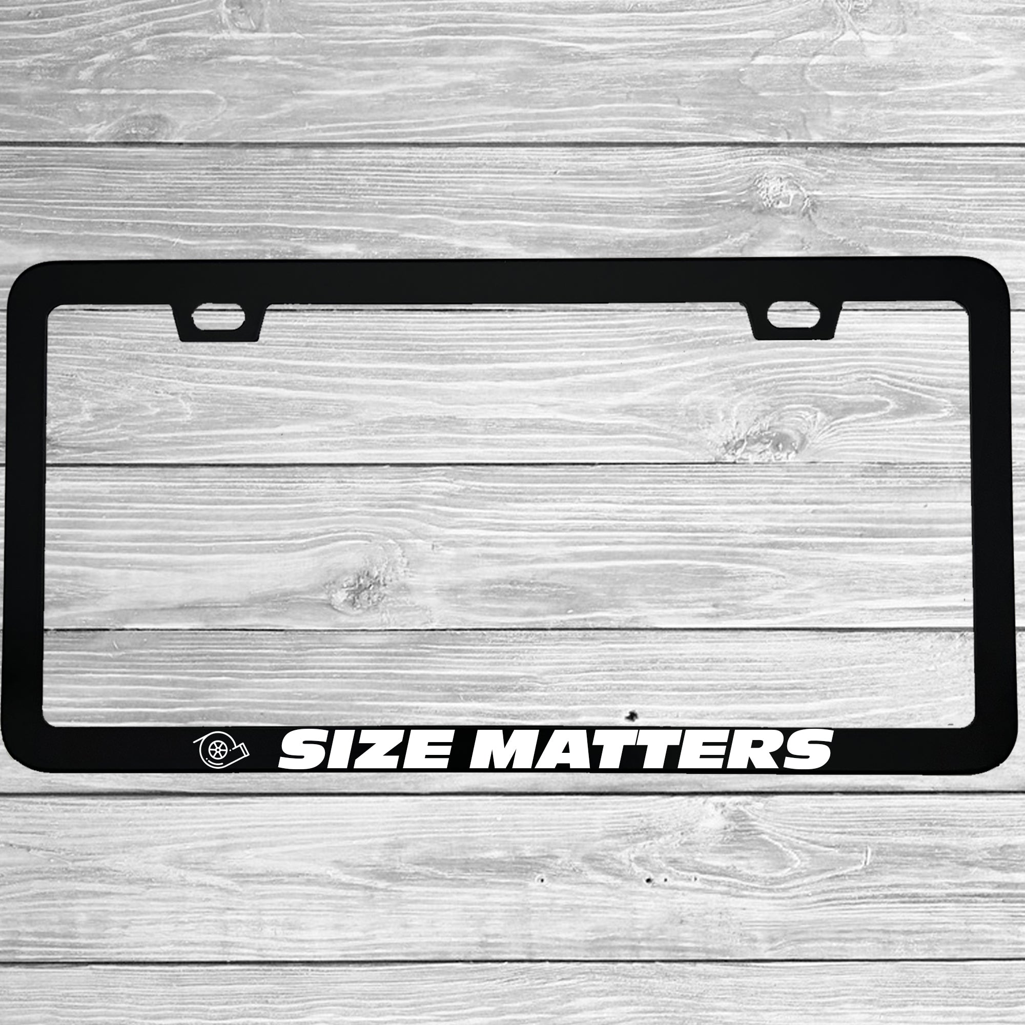 Close-up of "Size Matters" license plate frame showing fade-proof print quality