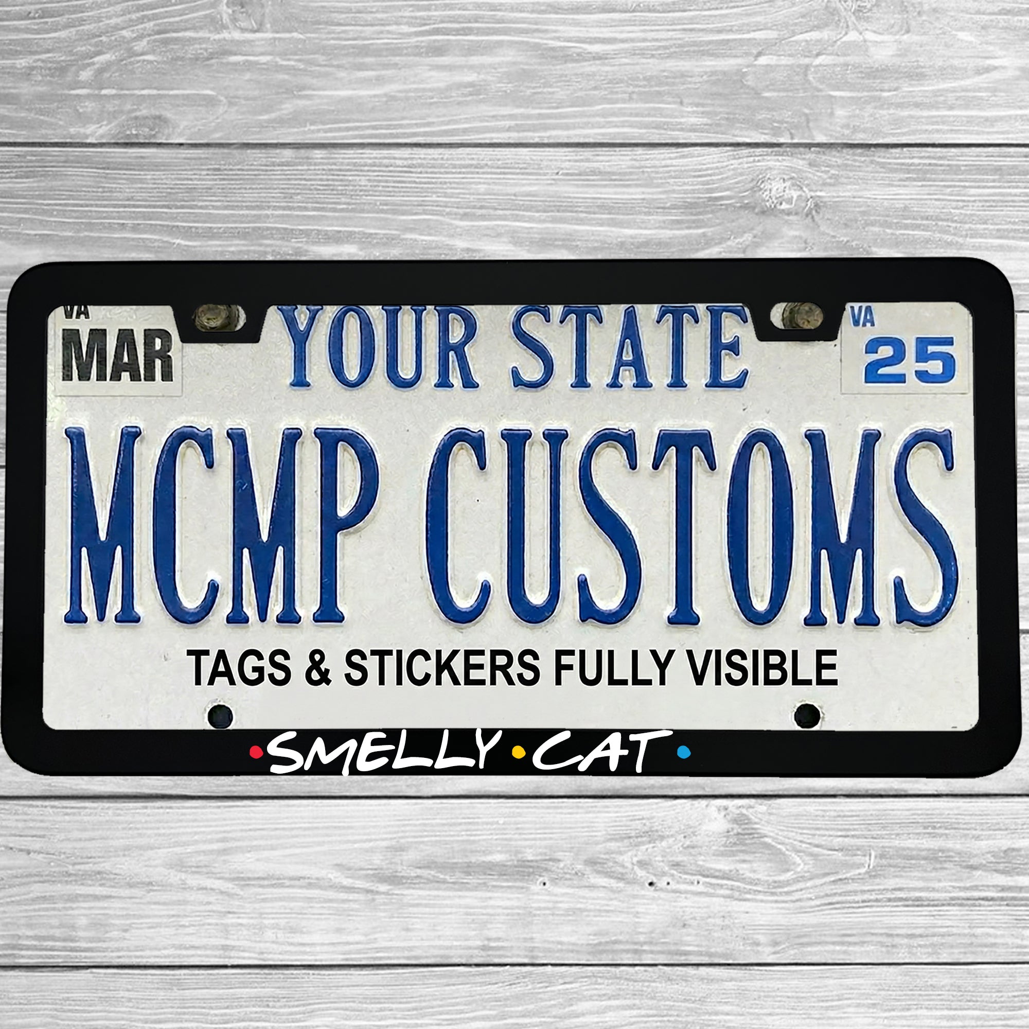 "Smelly Cat" license plate frame shown on vehicle — lifestyle photo