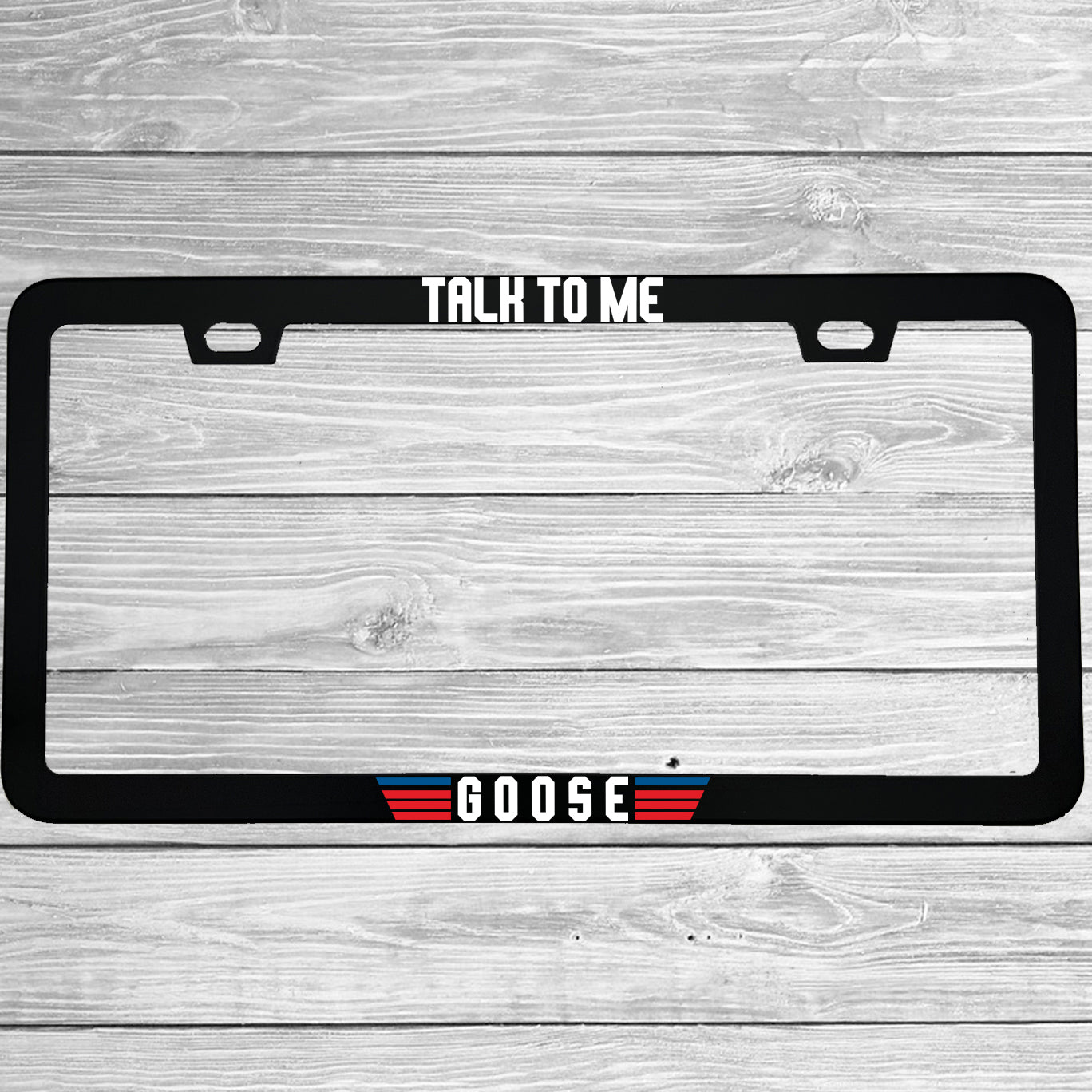 Close-up of "Talk To Me Goose" license plate frame showing fade-proof print quality