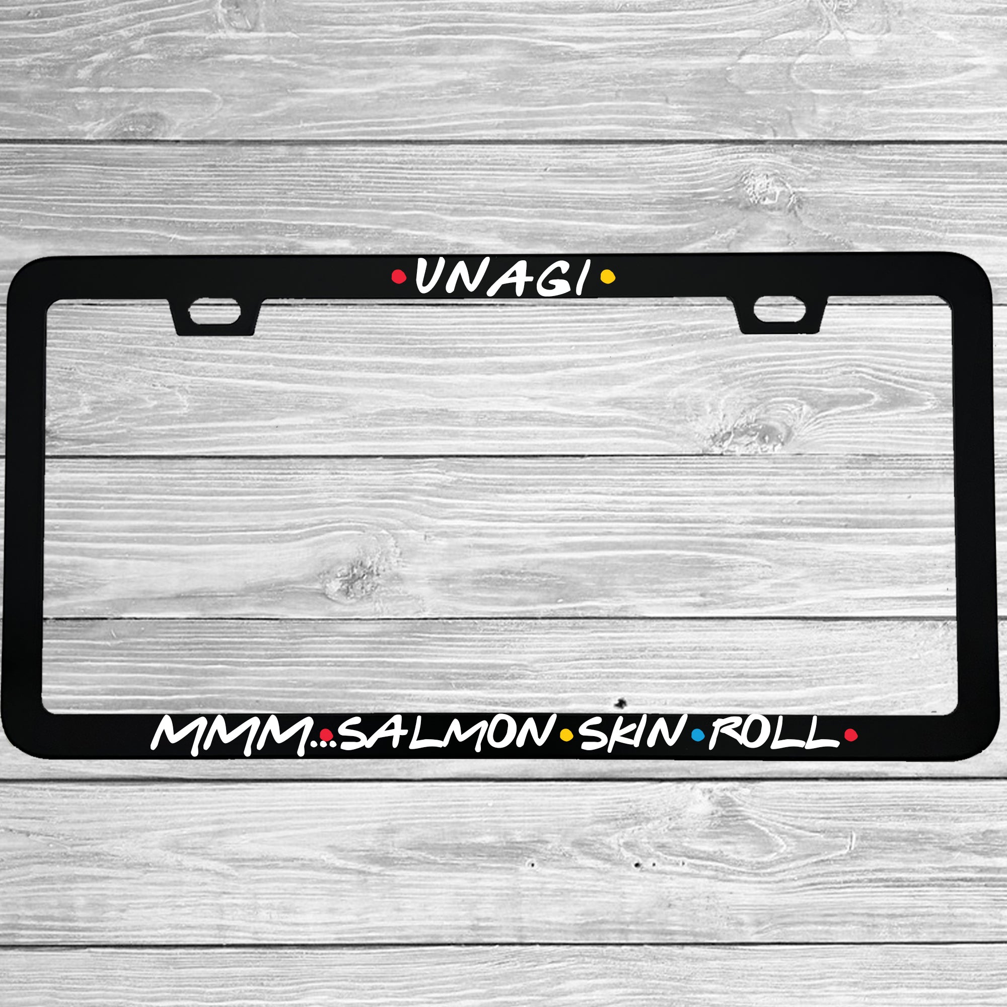 Close-up of "Unagi Mmm Salmon Skin Roll" license plate frame showing fade-proof print quality