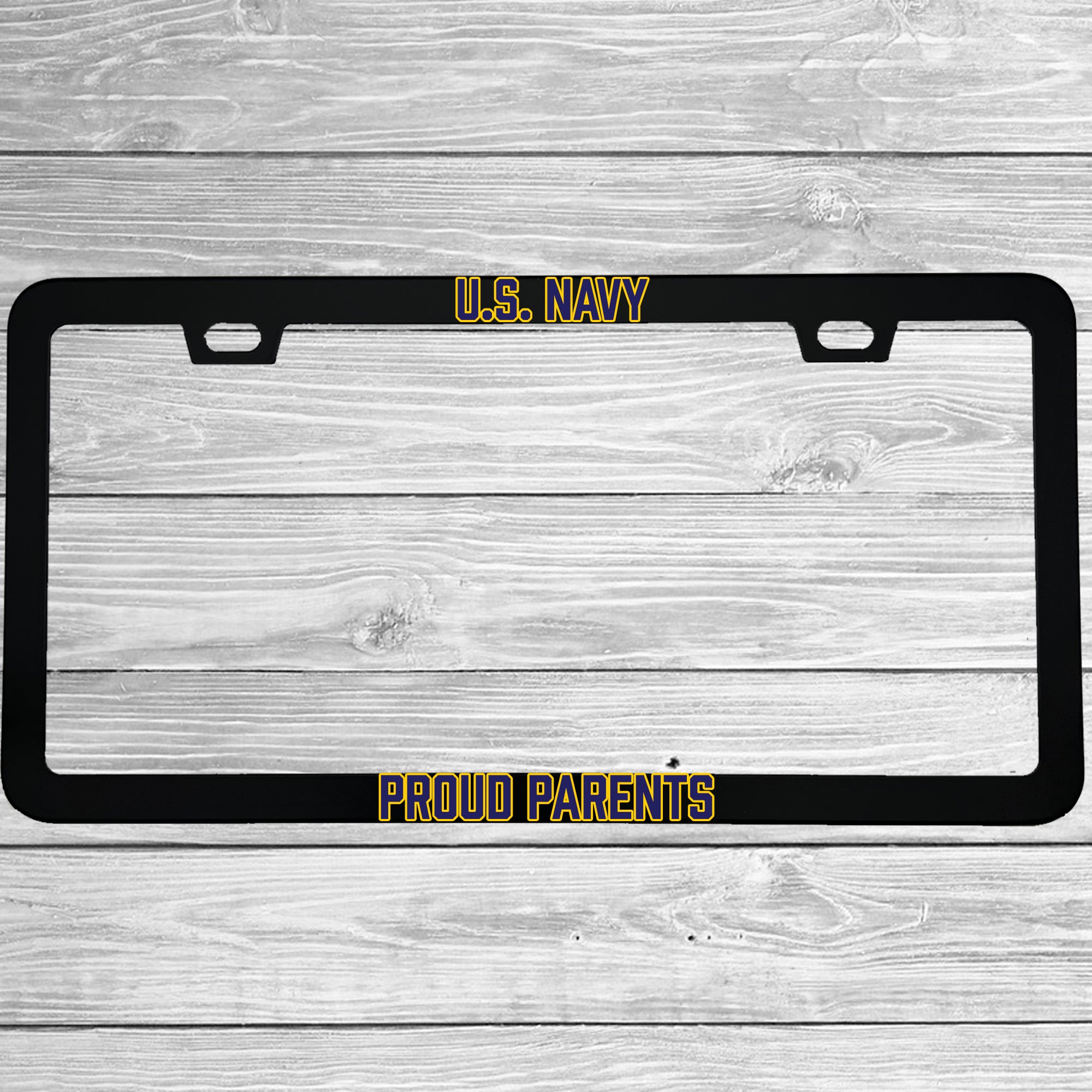Close-up of "U.S. Navy Proud Parents" license plate frame showing fade-proof print quality