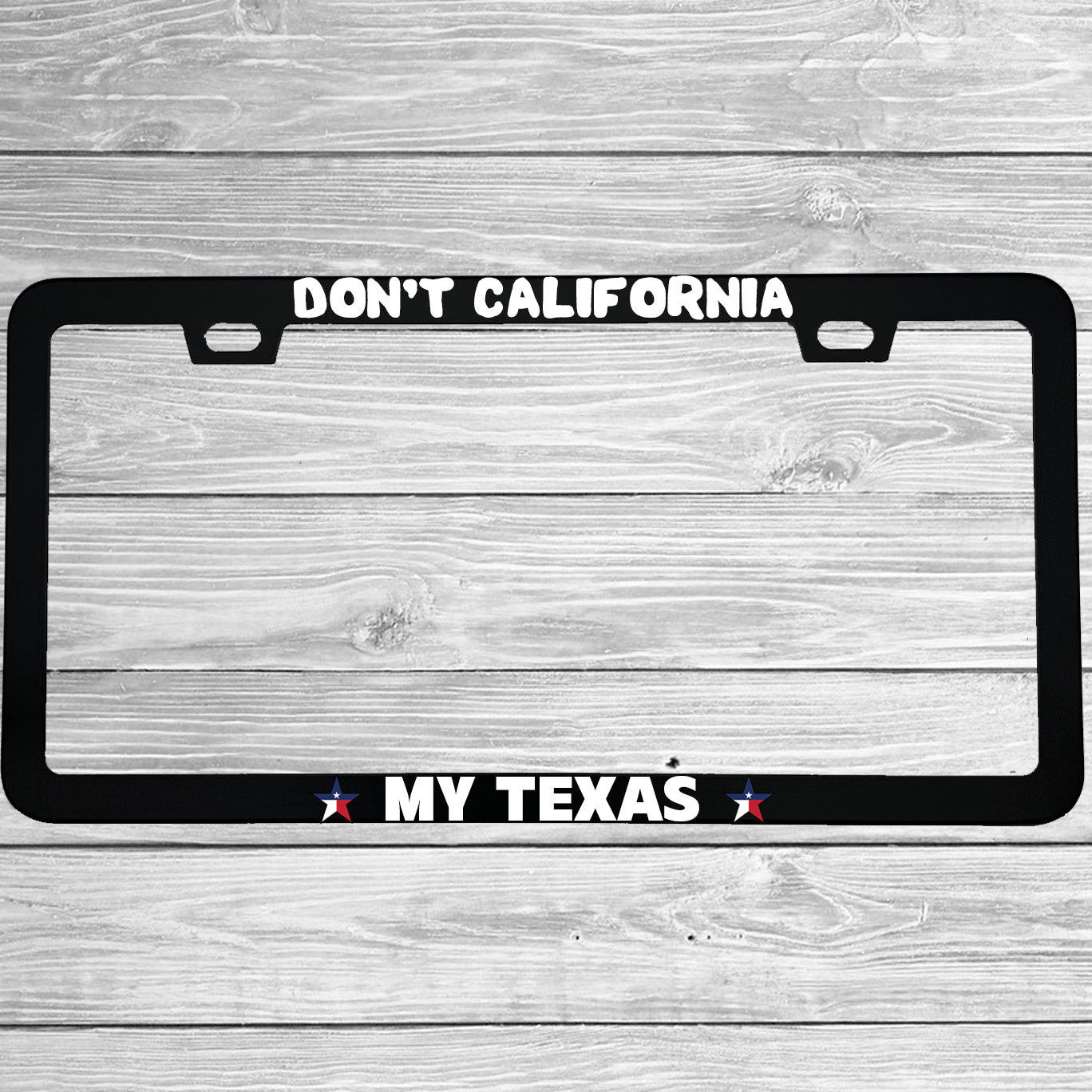 Close-up of "Don't California My Texas" license plate frame showing fade-proof print quality