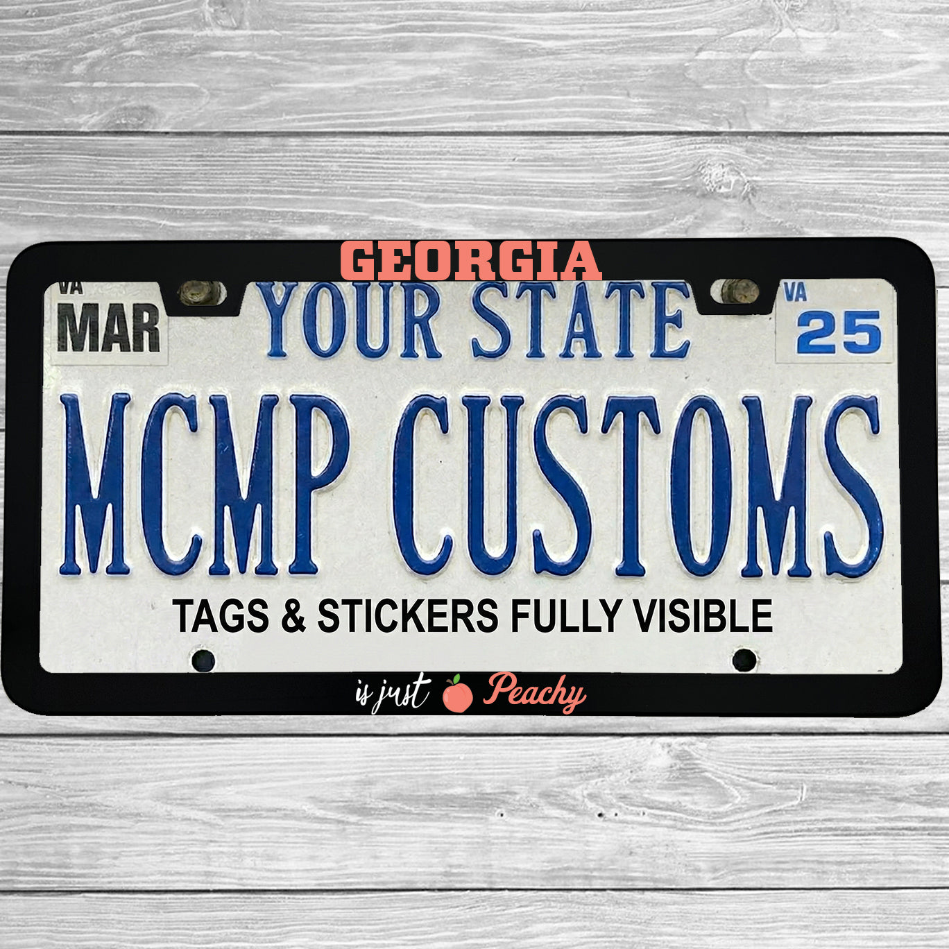 "Georgia Is Just Peachy" license plate frame shown on vehicle — lifestyle photo