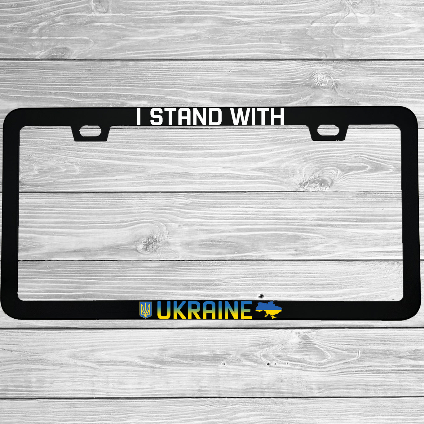 Close-up of "I Stand With Ukraine" license plate frame showing fade-proof print quality