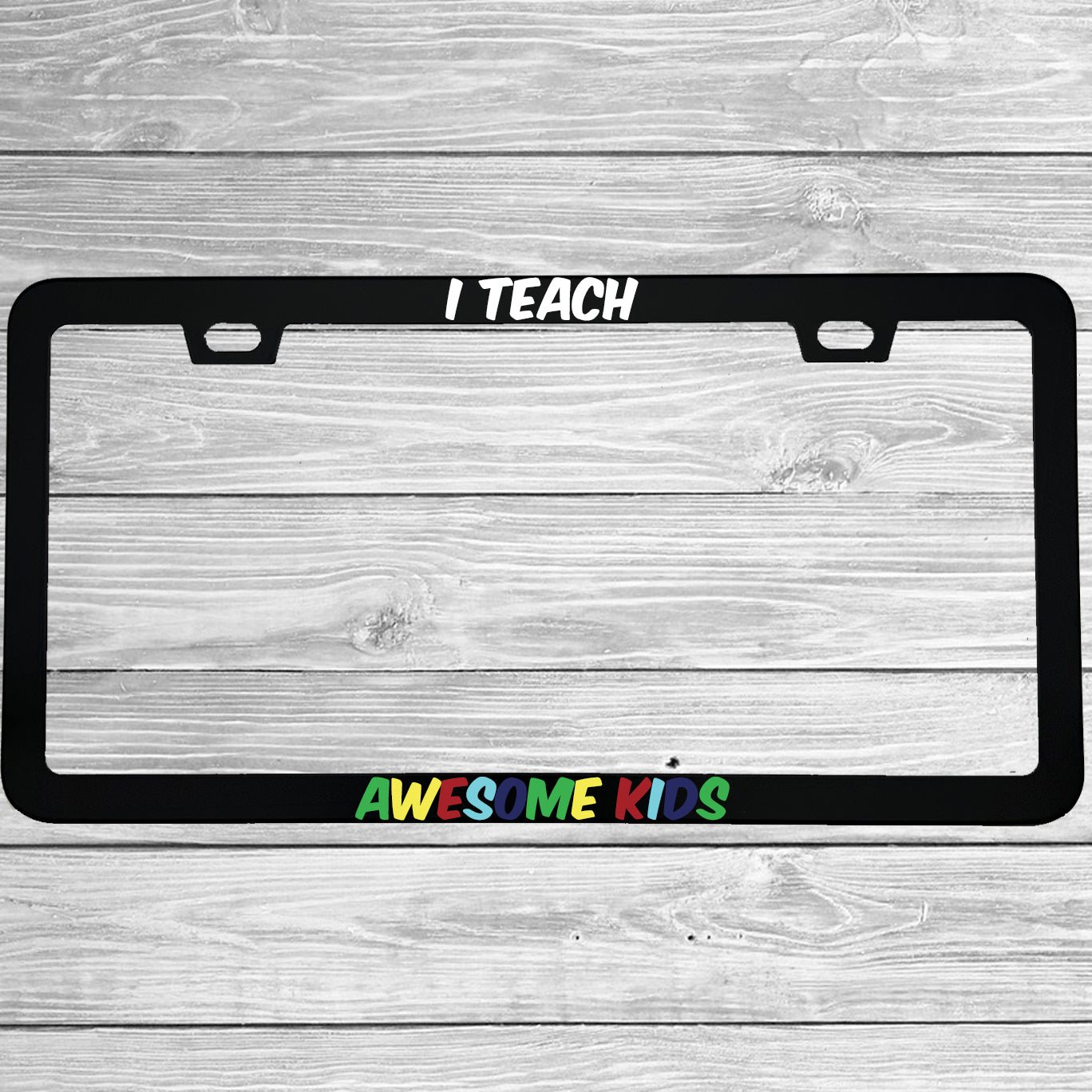 Close-up of "I Teach Awesome Kids Autism Awareness" license plate frame showing fade-proof print quality