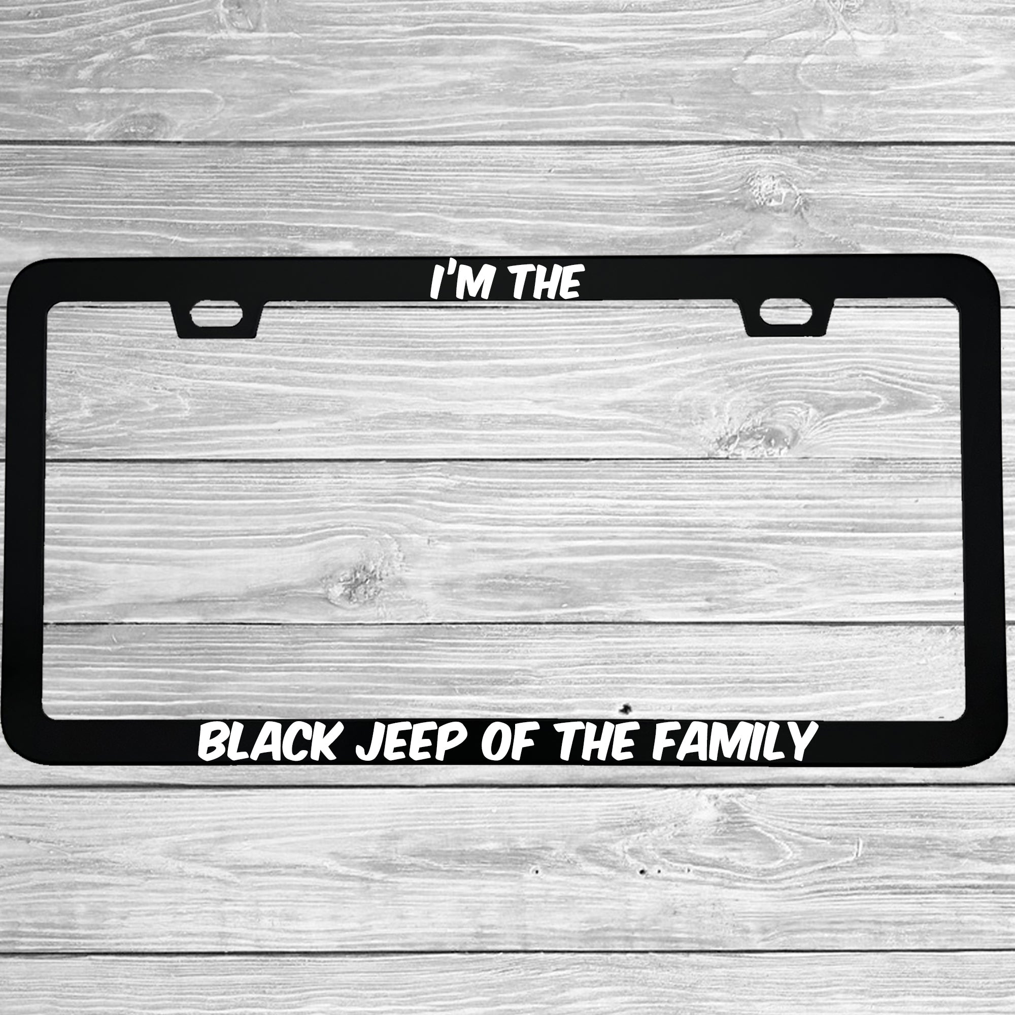 Close-up of "I'm The Black Jeep Of The Family" license plate frame showing fade-proof print quality