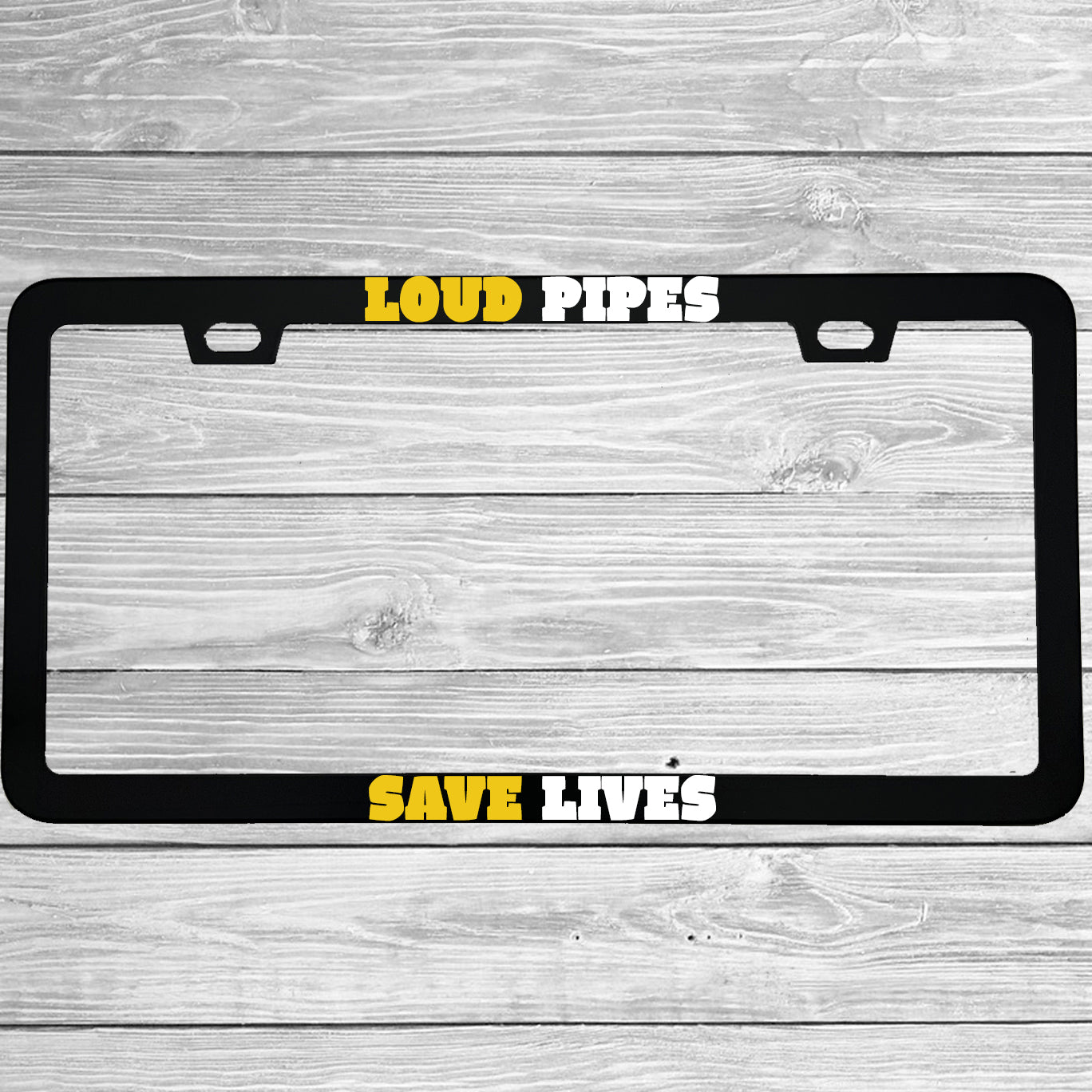 Close-up of "Loud Pipes Save Lives" license plate frame showing fade-proof print quality