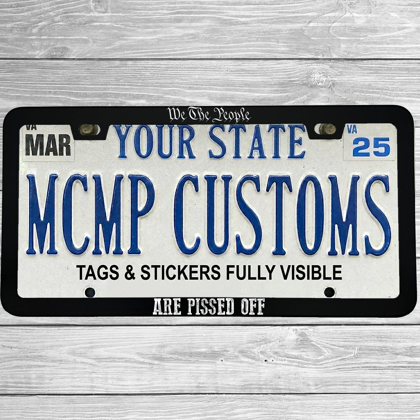 "We The People Are Pissed Off" license plate frame shown on vehicle β lifestyle photo