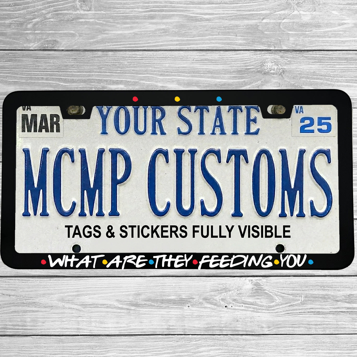 "What Are They Feeding You" license plate frame shown on vehicle — lifestyle photo