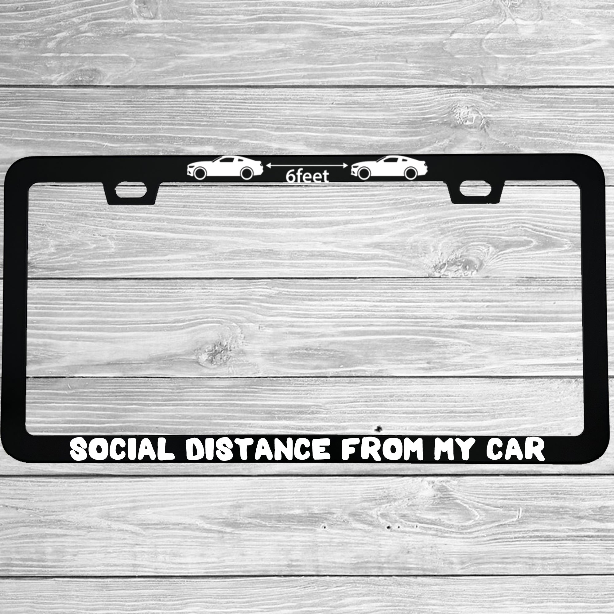 Close-up of "6 Feet Social Distance From My Car" license plate frame showing fade-proof print quality
