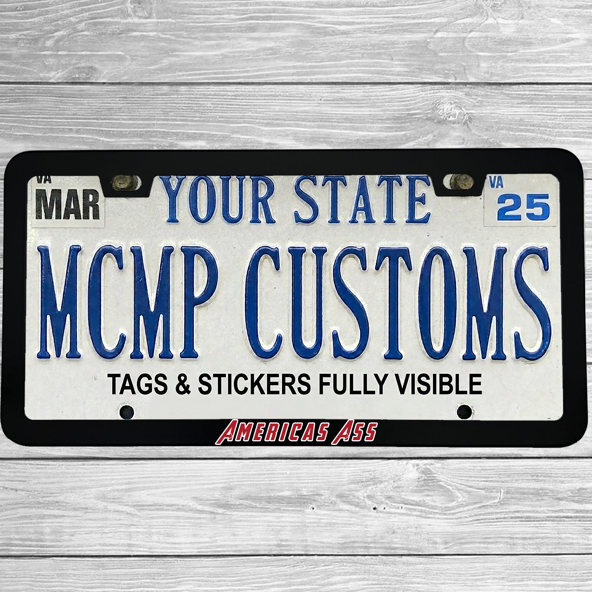 "America's Ass" license plate frame shown on vehicle — lifestyle photo
