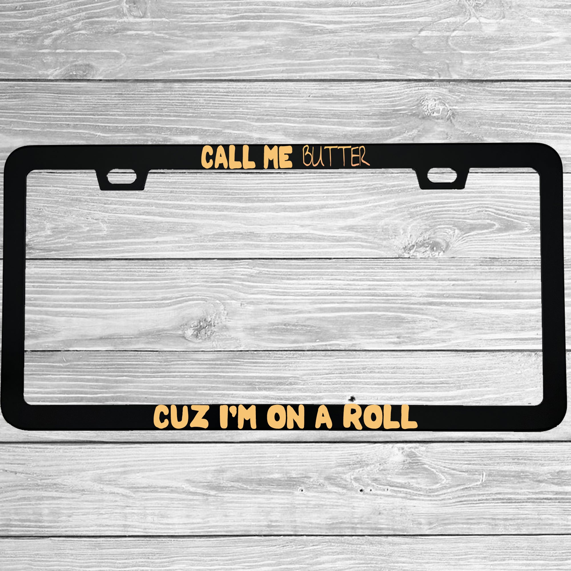 Close-up of "Call Me Butter Cuz I'm On A Roll" license plate frame showing fade-proof print quality