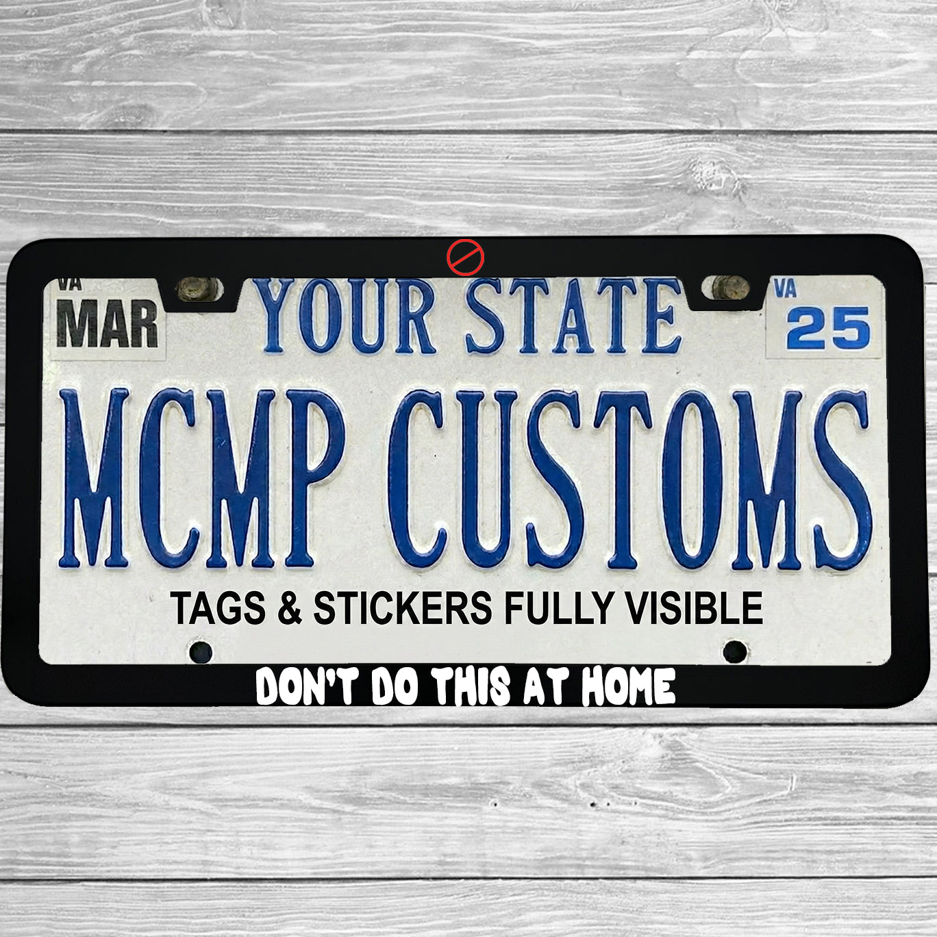 "Don't Do This At Home" license plate frame shown on vehicle — lifestyle photo