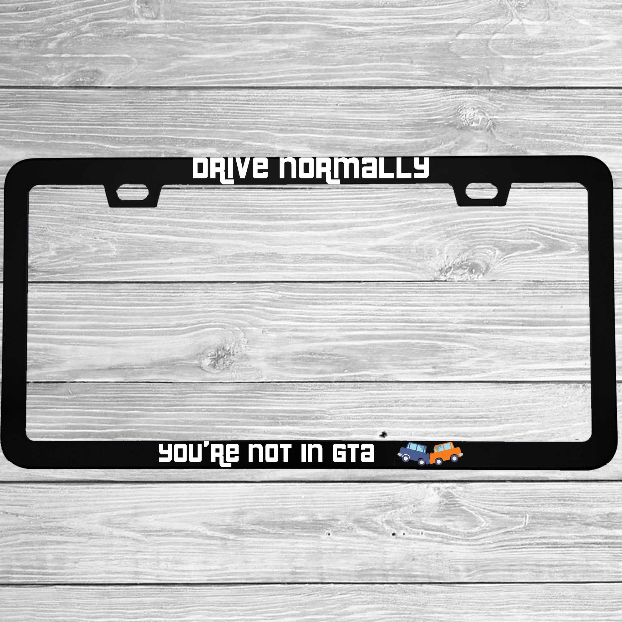 Close-up of "Drive Normally You're Not In GTA" license plate frame showing fade-proof print quality