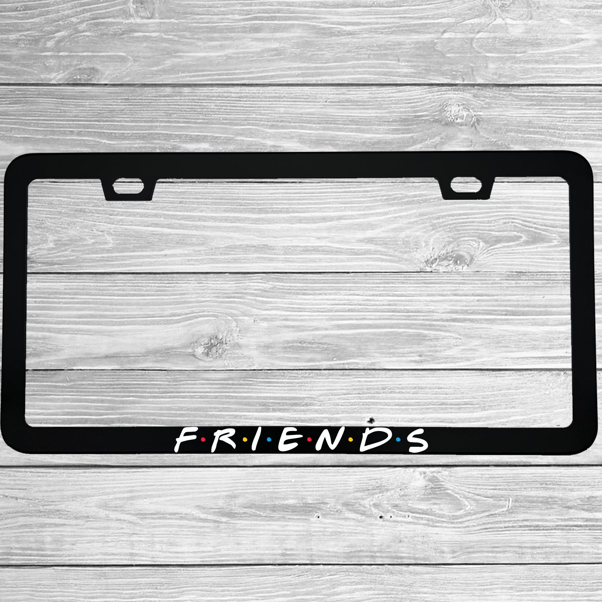 Close-up of "Friends TV Show Logo" license plate frame showing fade-proof print quality