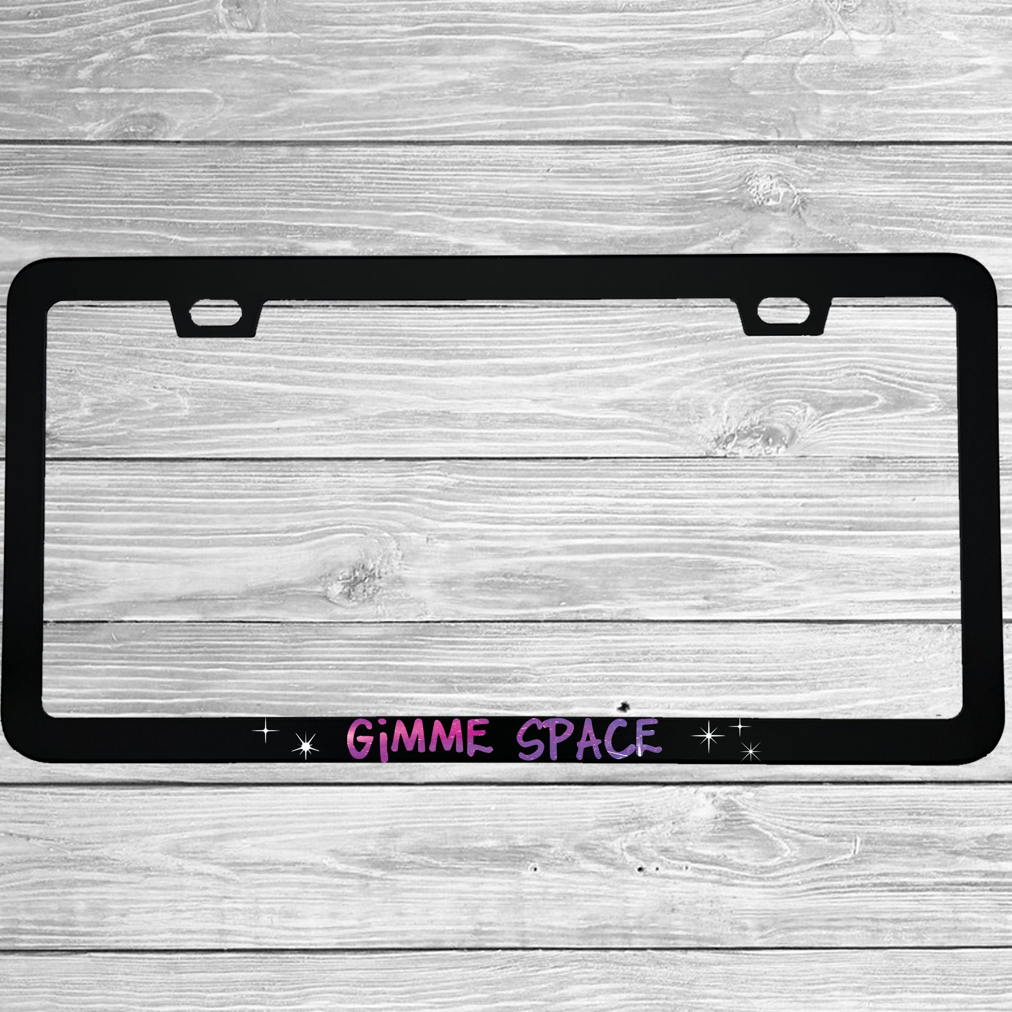 Close-up of "Gimme Space" license plate frame showing fade-proof print quality