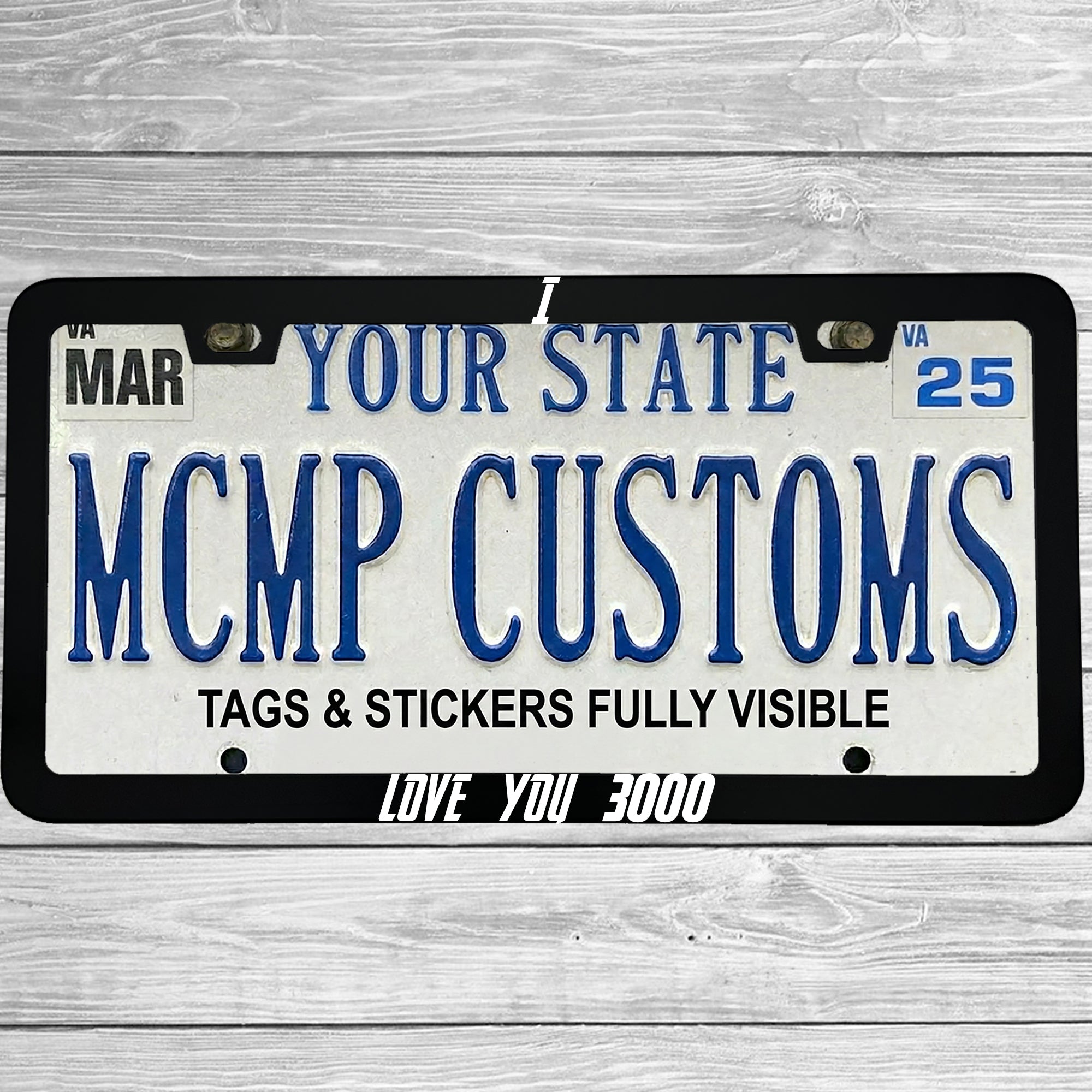 "I Love You 3000" license plate frame shown on vehicle — lifestyle photo