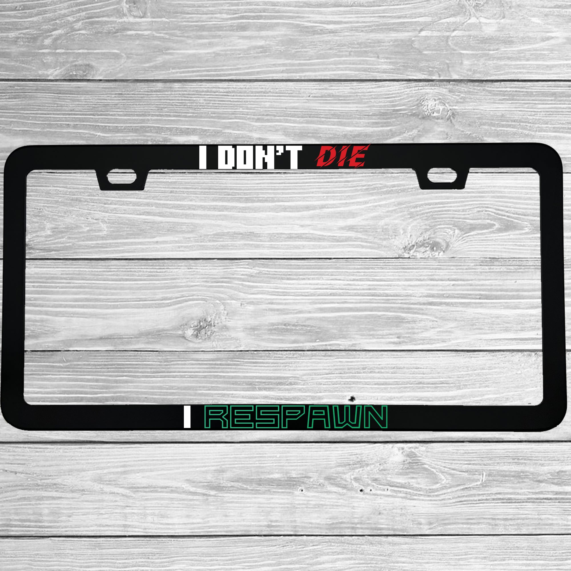 Close-up of "I Don't Die, I Respawn" license plate frame showing fade-proof print quality