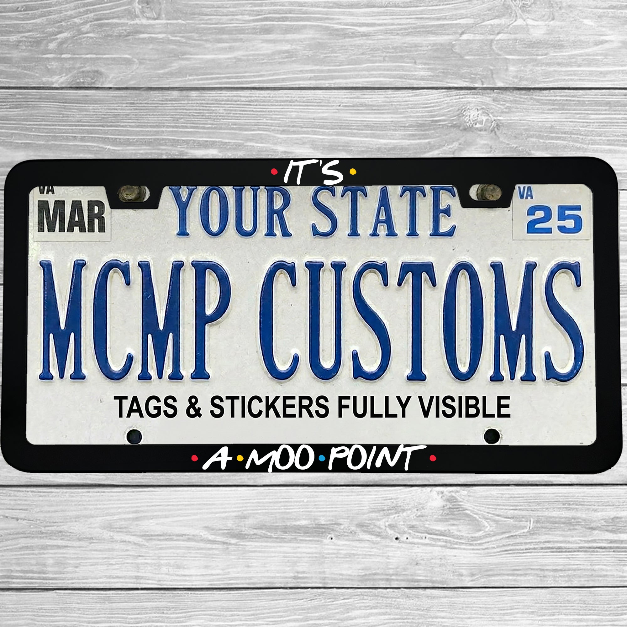 "Its A Moo Point" license plate frame shown on vehicle — lifestyle photo