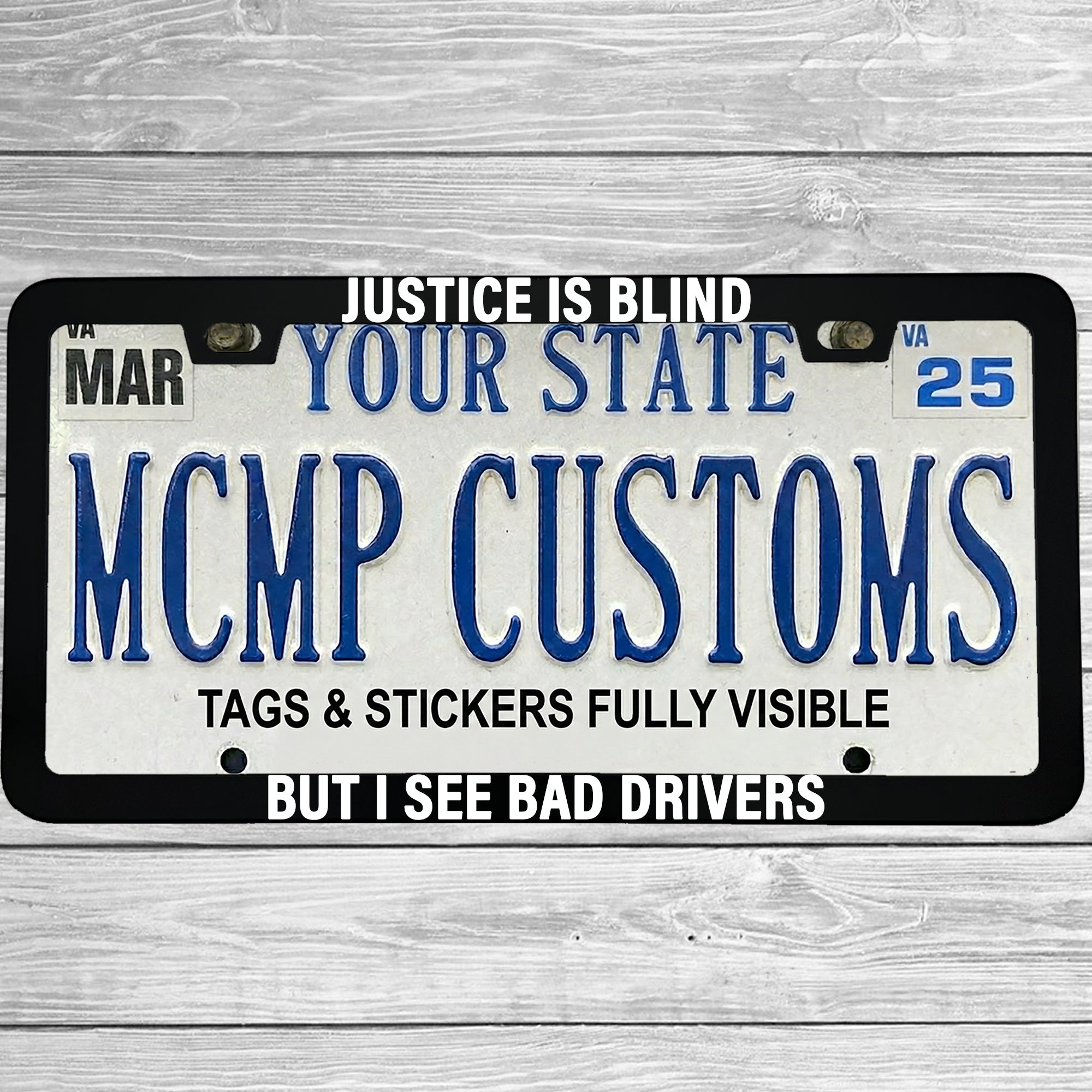 "Justice Is Blind, But I See Bad Drivers" license plate frame shown on vehicle — lifestyle photo