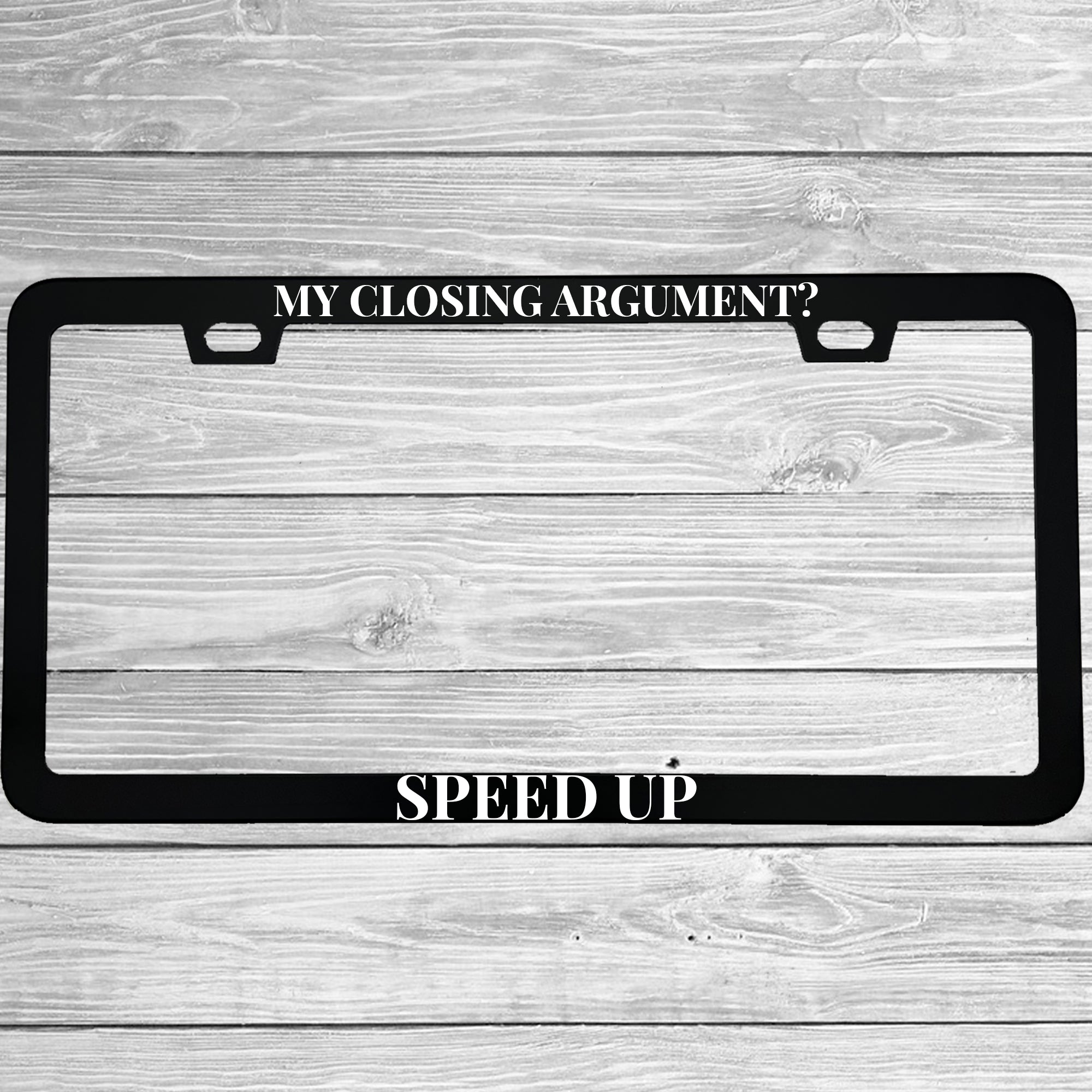 Close-up of "My Closing Argument? Speed Up!" license plate frame showing fade-proof print quality