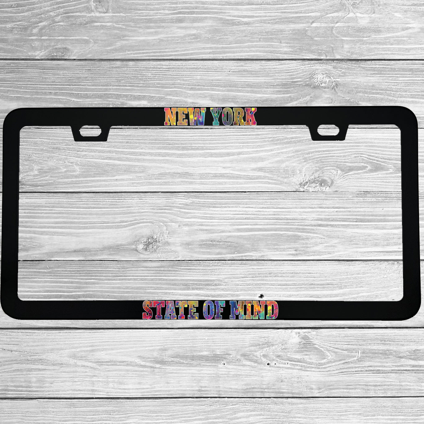 Close-up of "New York State Of Mind" license plate frame showing fade-proof print quality