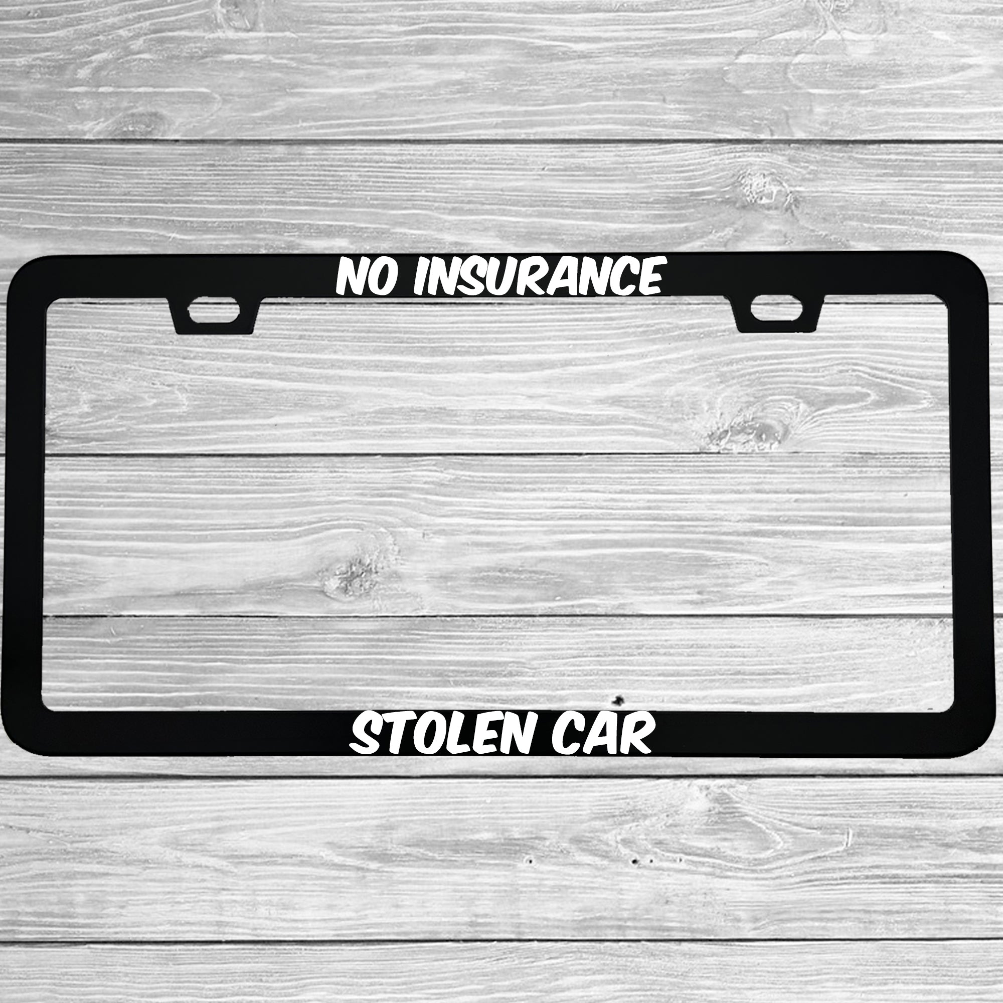 Close-up of "No Insurance Stolen Car" license plate frame showing fade-proof print quality