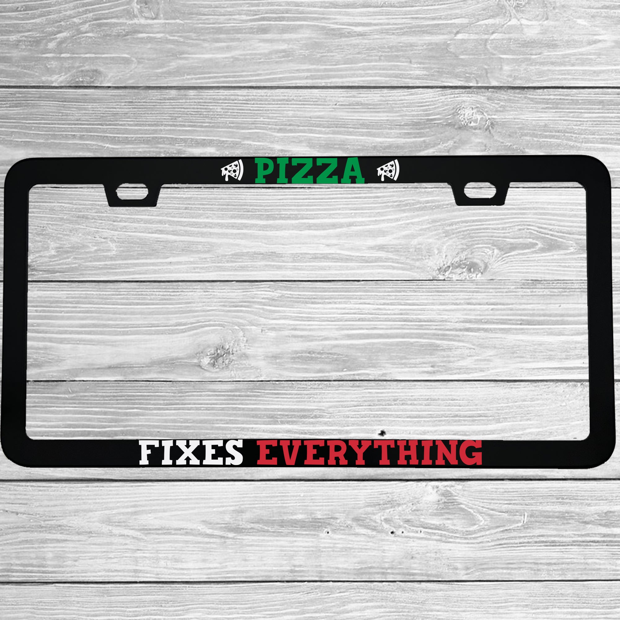 Close-up of "Pizza Fixes Everything" license plate frame showing fade-proof print quality