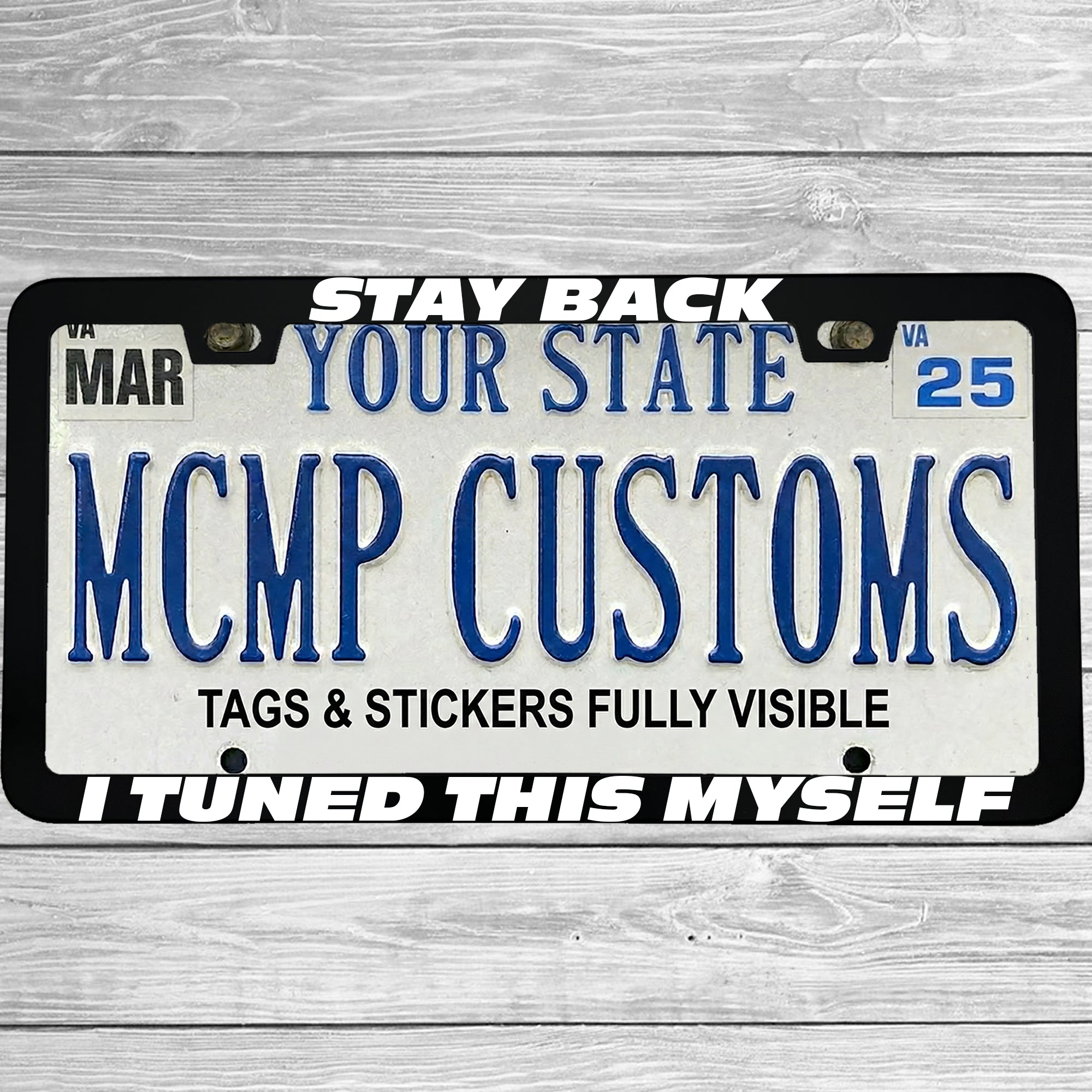 "Stay Back I Tuned This Myself" license plate frame shown on vehicle — lifestyle photo