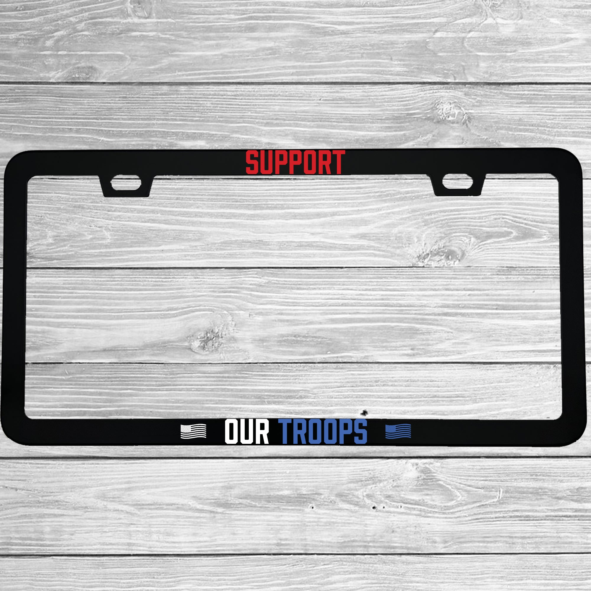 Close-up of "Support Our Troops" license plate frame showing fade-proof print quality
