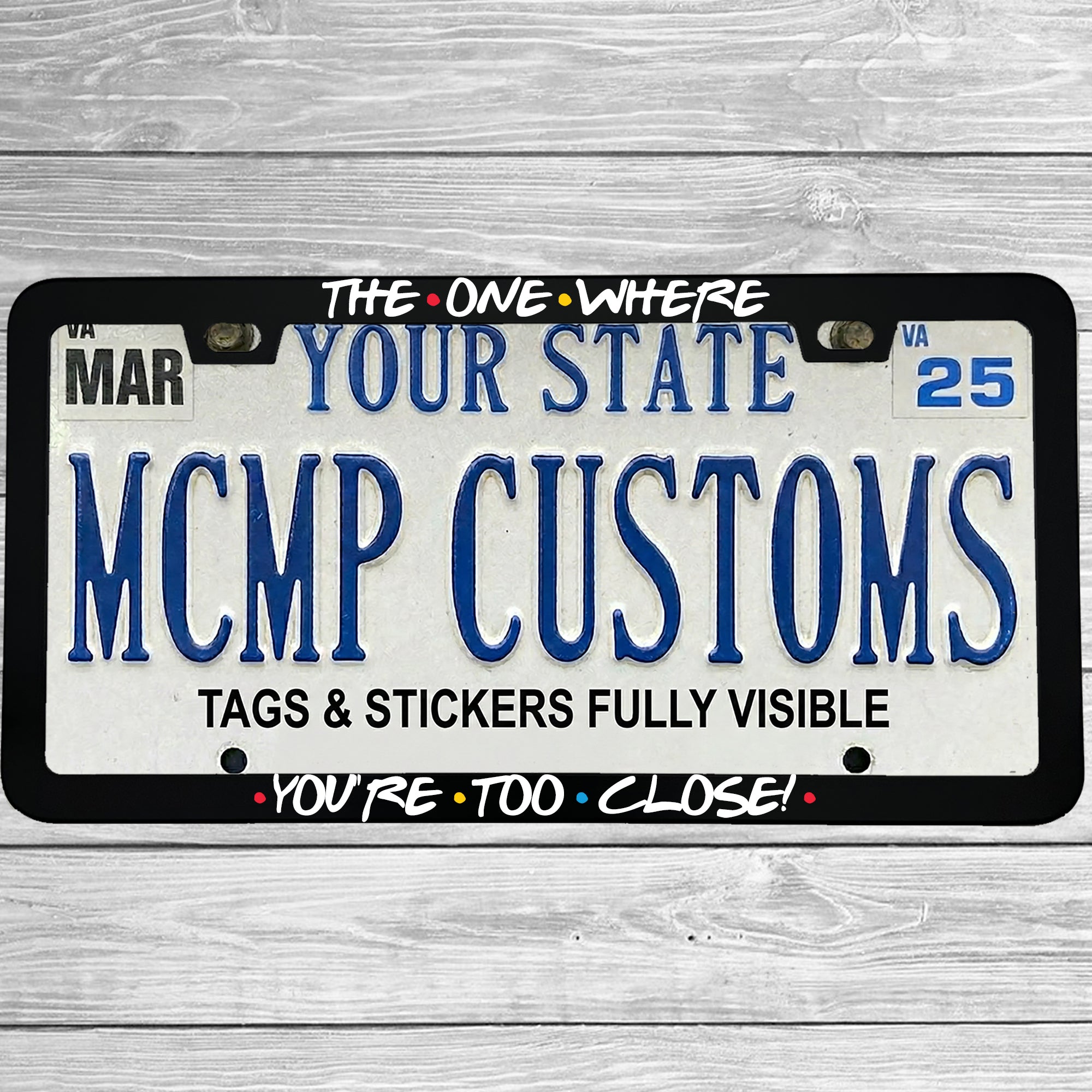 "The One Where You're Too Close" license plate frame shown on vehicle — lifestyle photo