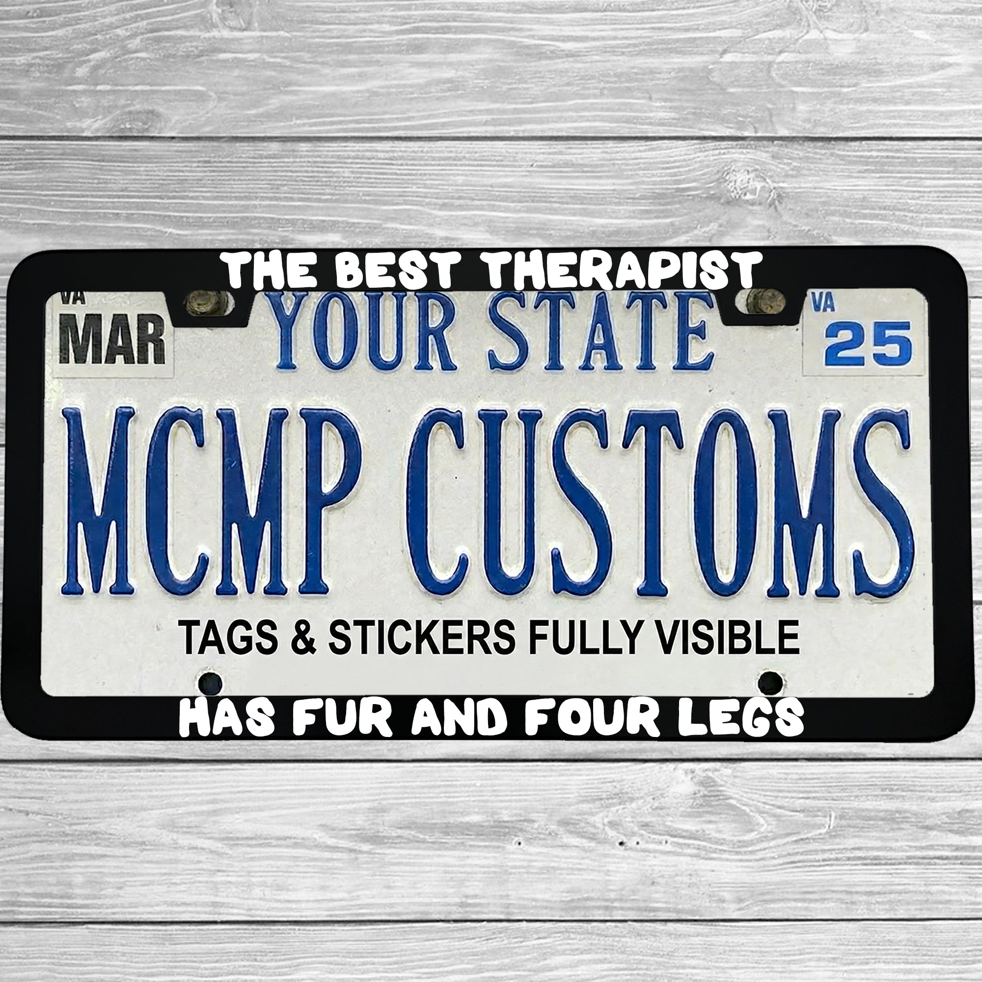 "The Best Therapist Has Fur And Four Legs" license plate frame shown on vehicle — lifestyle photo