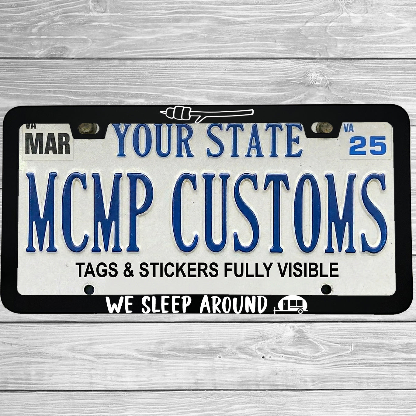 "We Sleep Around" license plate frame shown on vehicle — lifestyle photo
