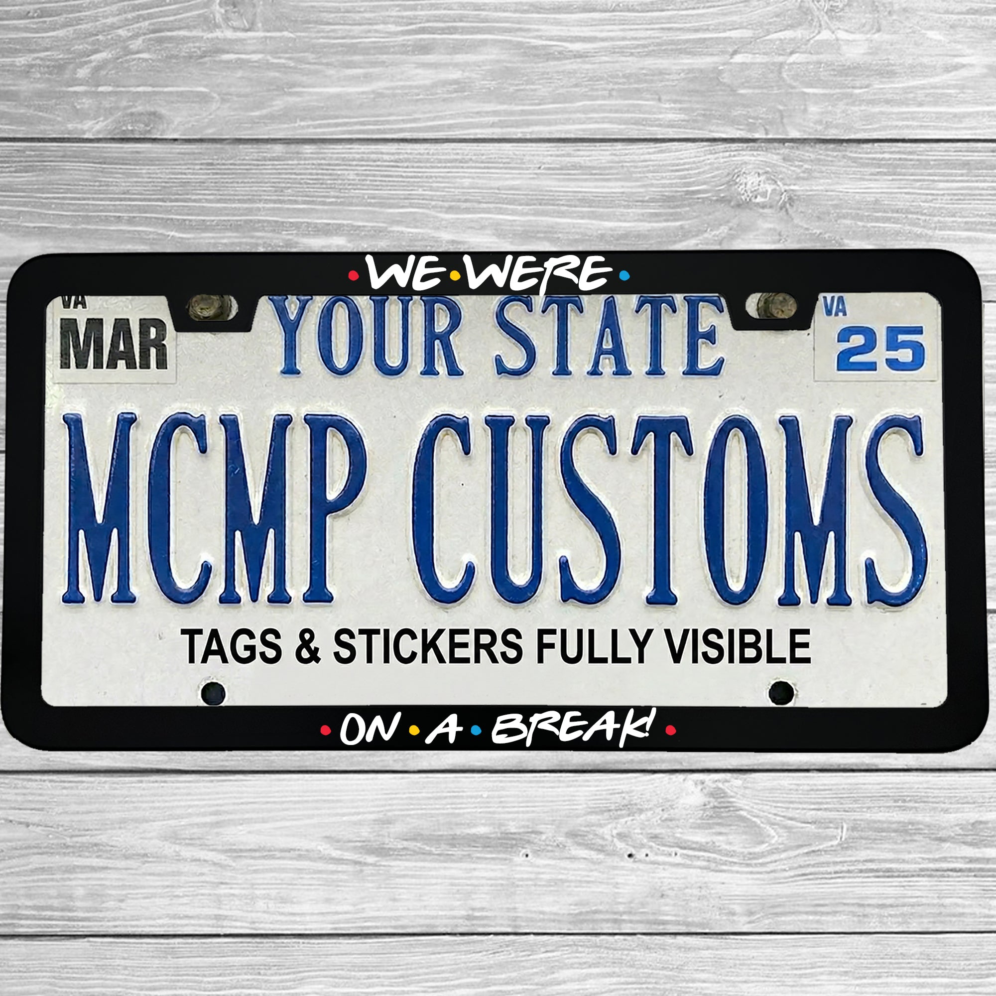 "We Were On A Break!" license plate frame shown on vehicle — lifestyle photo