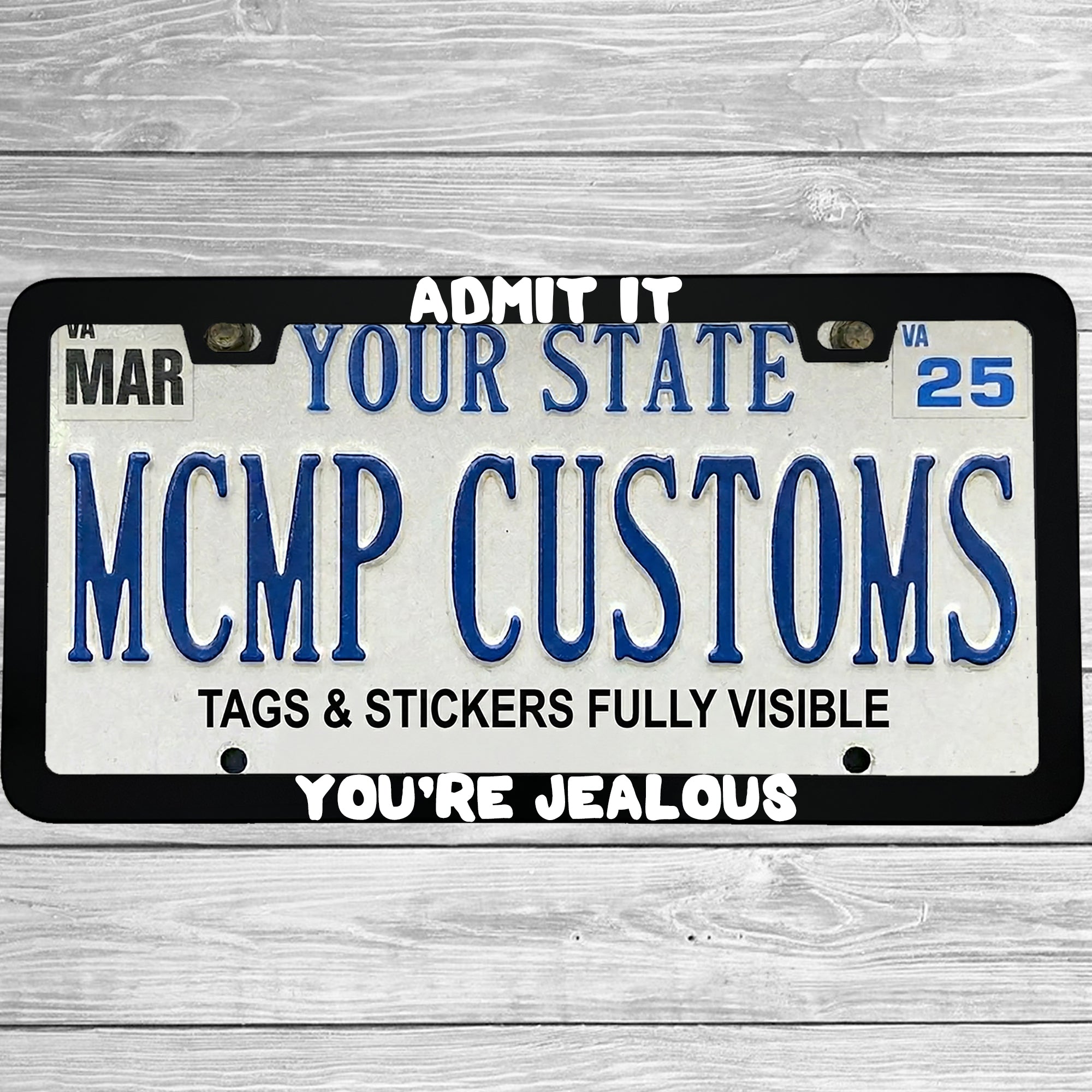 "Admit It You're Jealous" license plate frame shown on vehicle — lifestyle photo