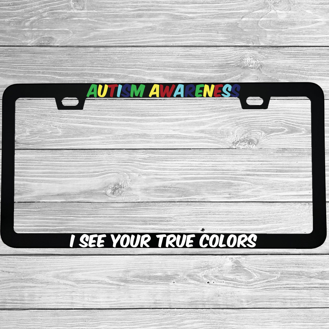 Close-up of "Autism Awareness I See Your True Colors" license plate frame showing fade-proof print quality