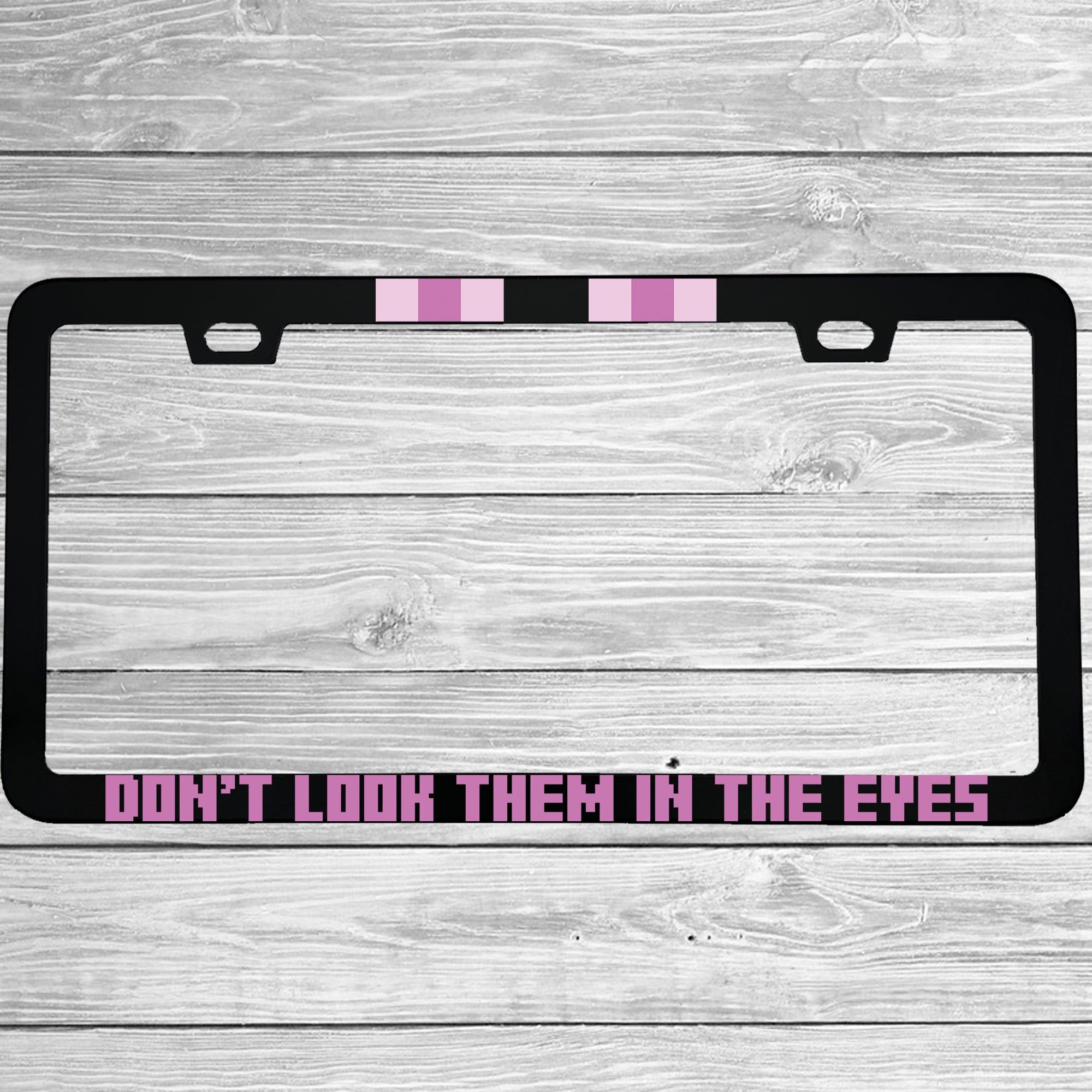 Close-up of "Don't Look Them In The Eyes Minecraft Enderman" license plate frame showing fade-proof print quality