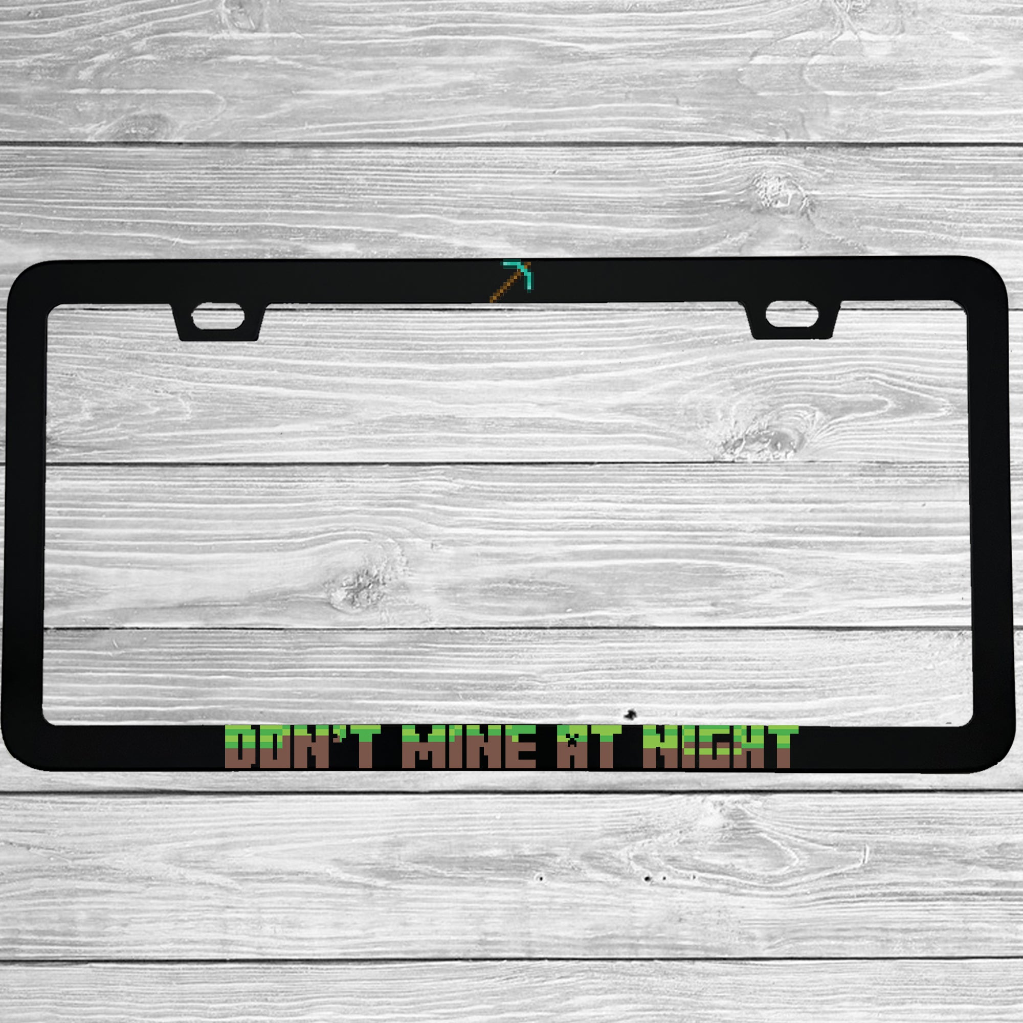 Close-up of "Don't Mine At Night Minecraft" license plate frame showing fade-proof print quality