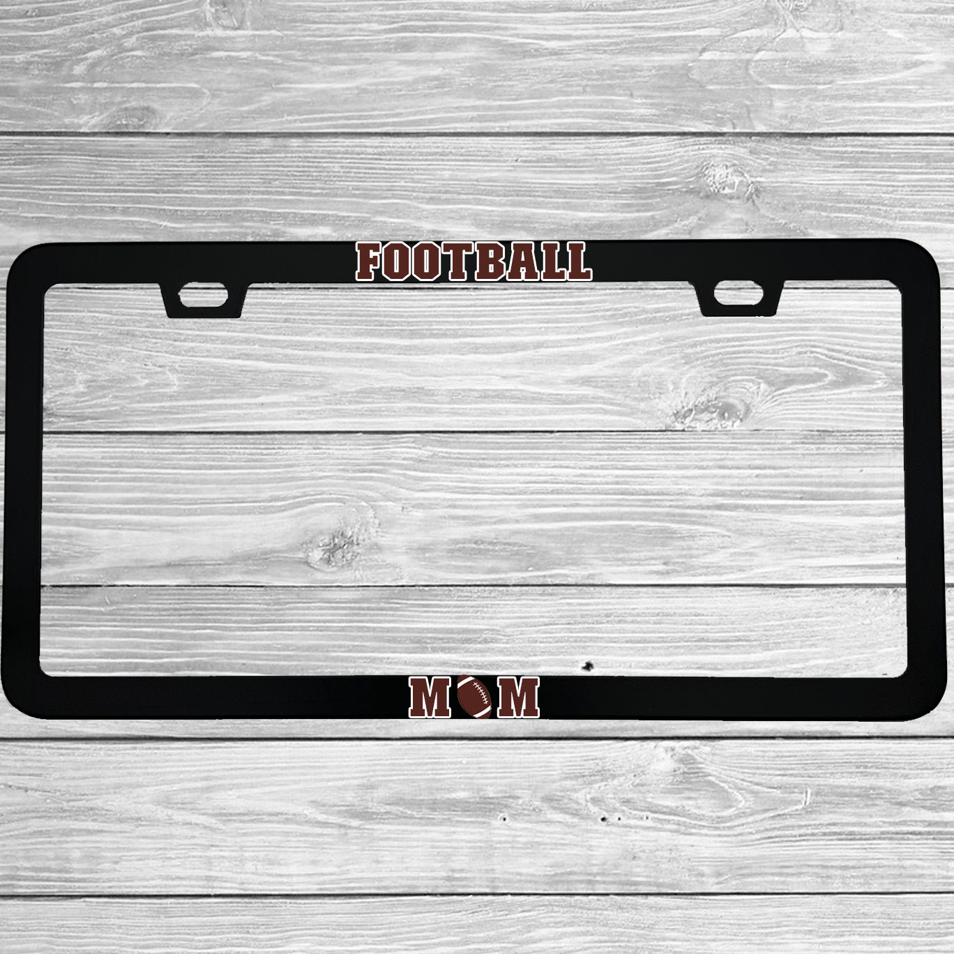 Close-up of "Football Mom" license plate frame showing fade-proof print quality