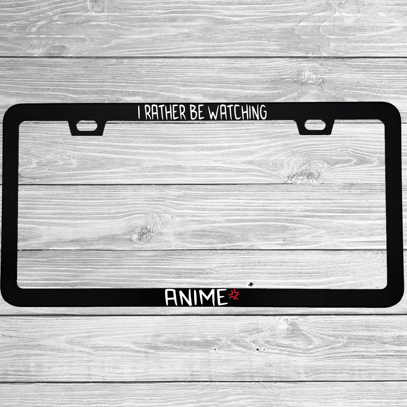 Close-up of "I'd Rather Be Watching Anime" license plate frame showing fade-proof print quality