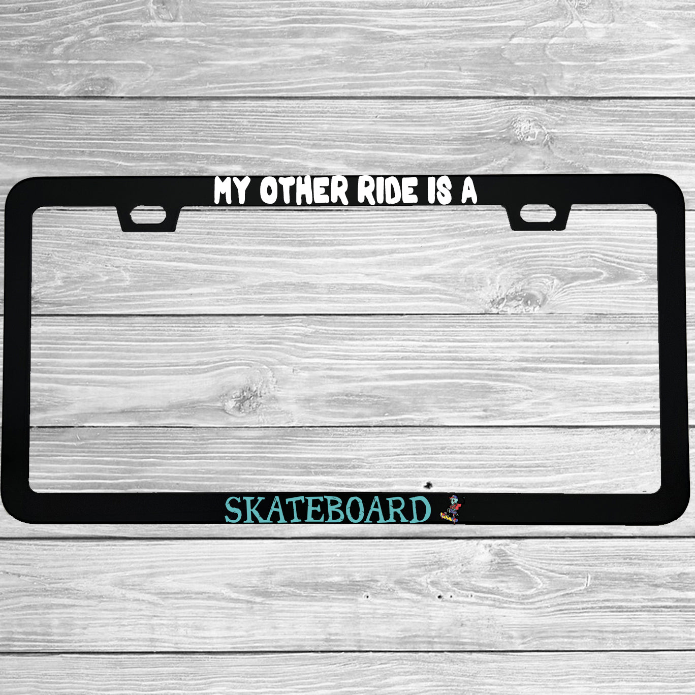 Close-up of "My Other Ride Is A Skateboard" license plate frame showing fade-proof print quality