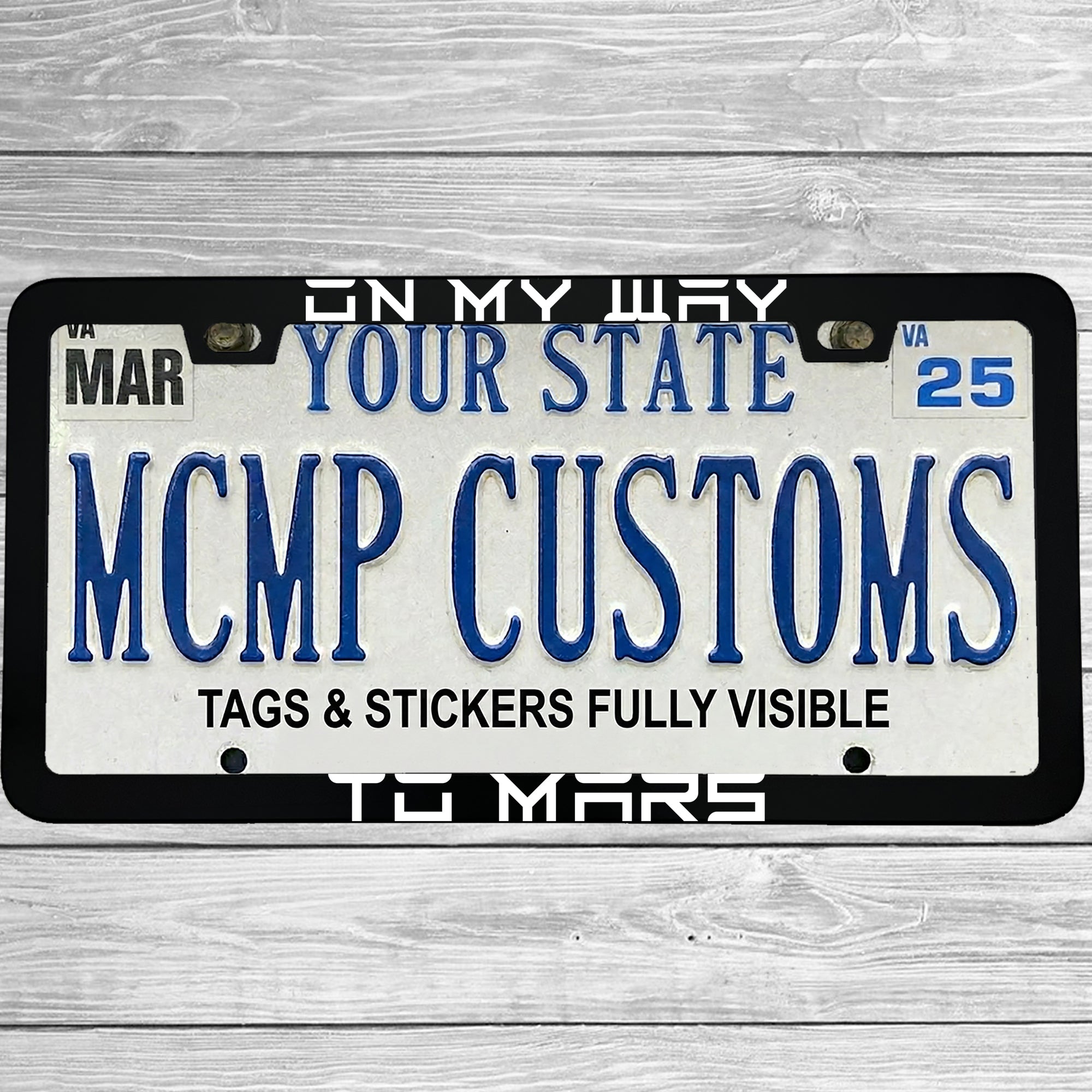 "On My Way To Mars Funny Electric Car Outer Space Themed" license plate frame shown on vehicle — lifestyle photo